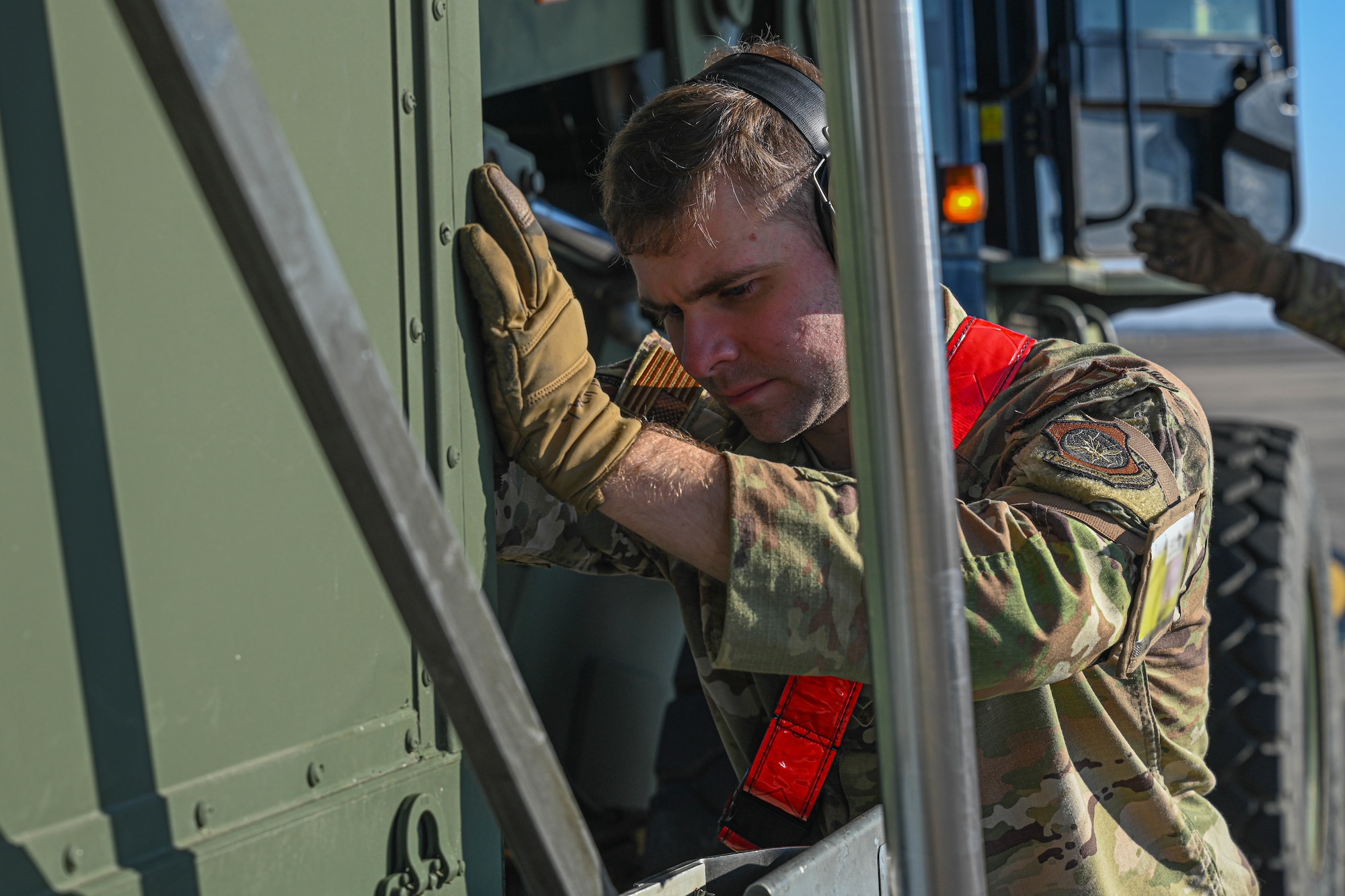 An Airman loads cargo.