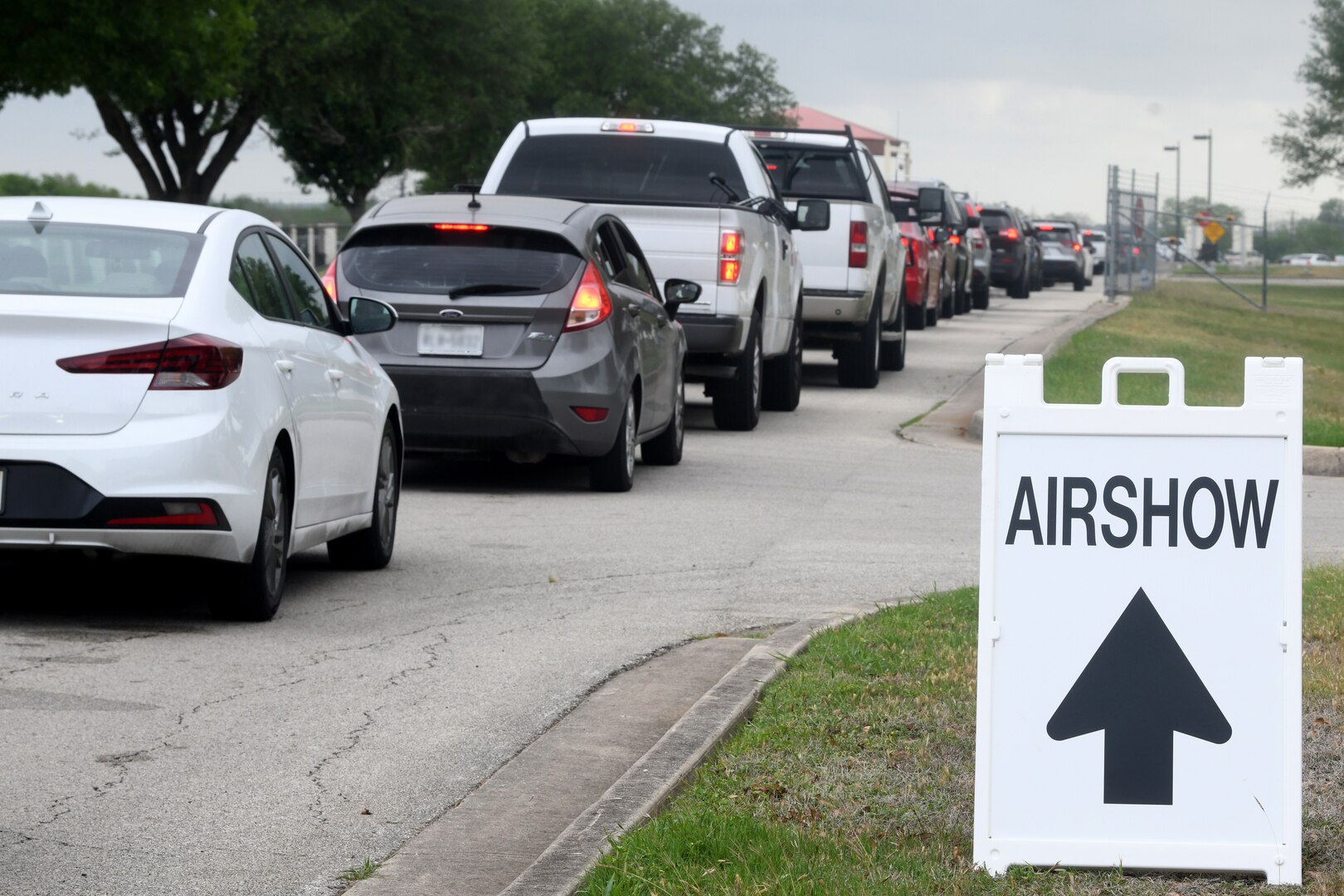 image of cars lining the roadway headed to the airshow gate