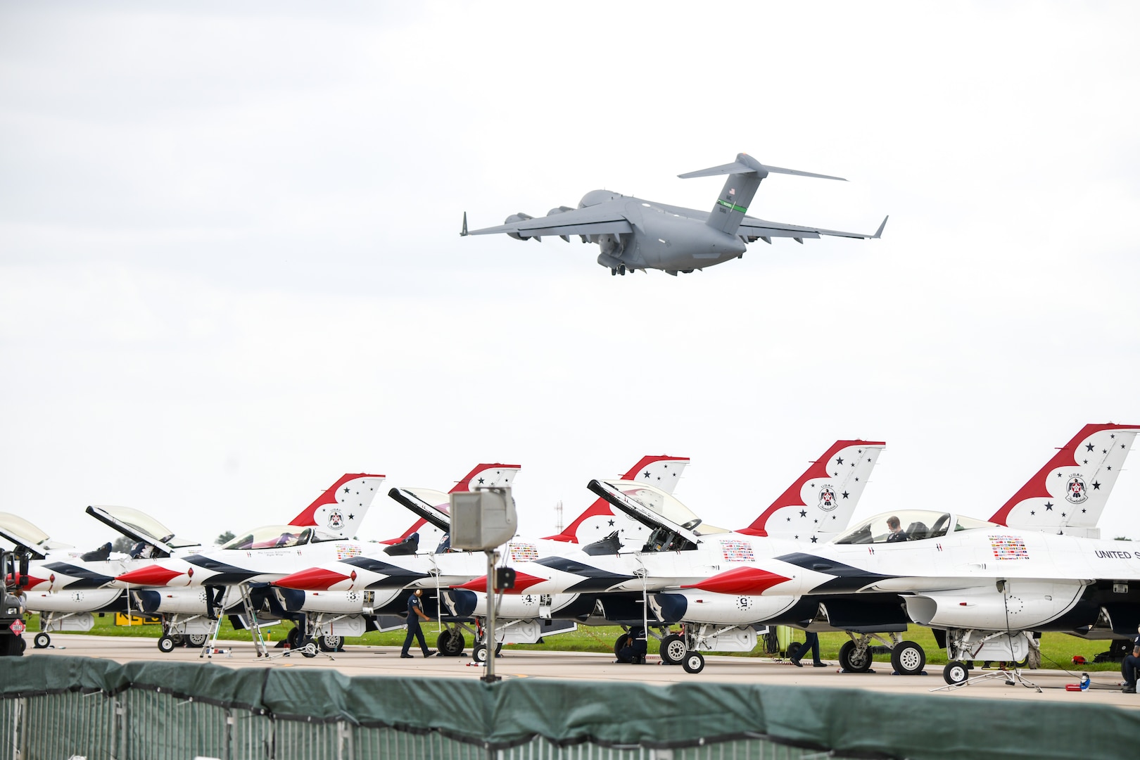 aircraft taking off in the background over fighter jets in the foreground