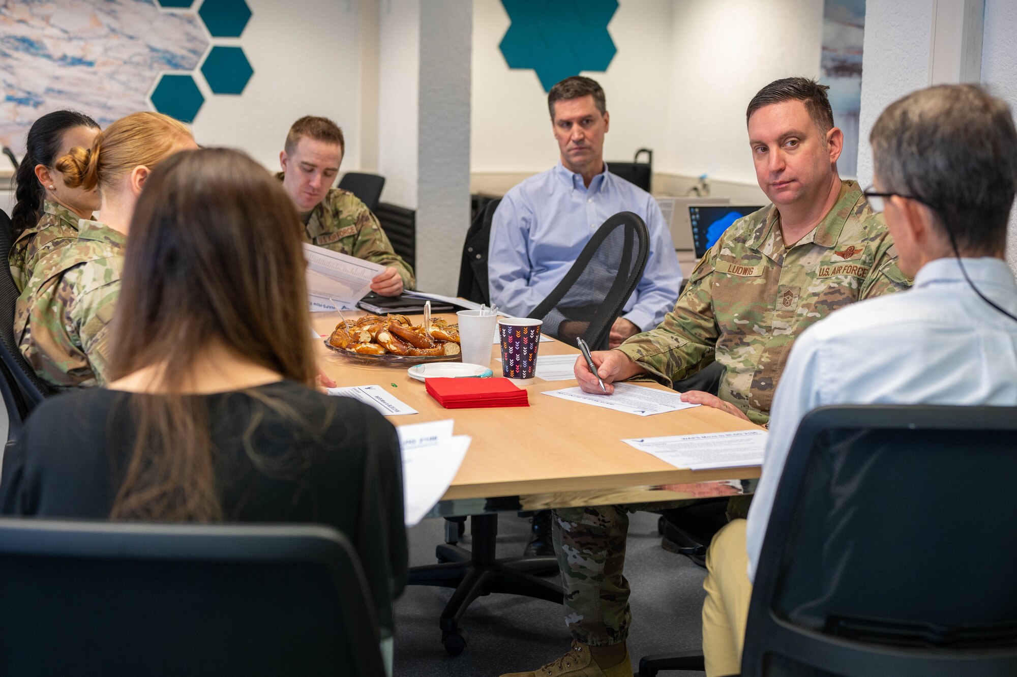 Ramstein leadership attends a brief on the Electronic Weighted Airman Promotion System