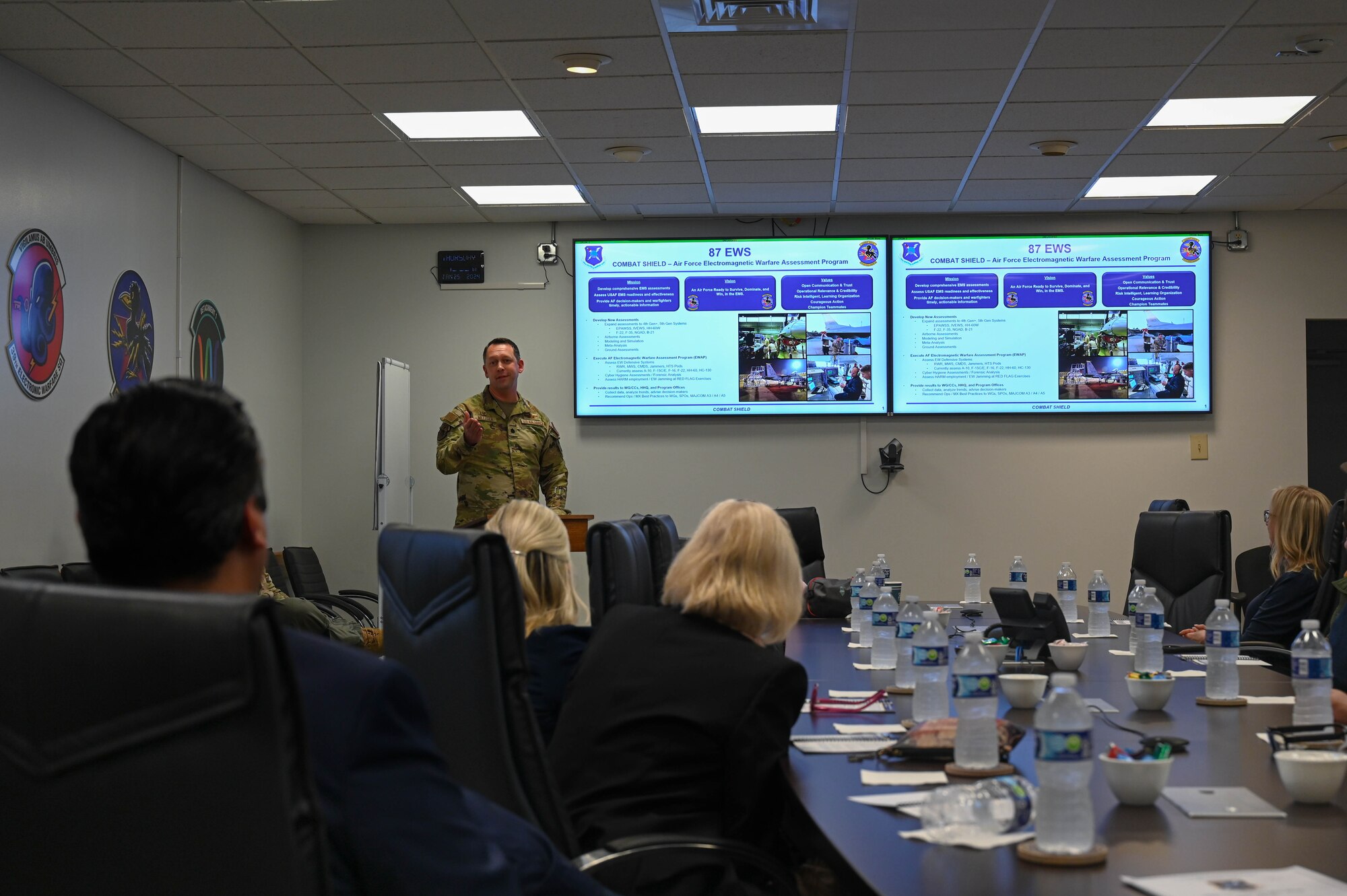 U.S. Air Force Lt. Col. Thomas Metzger, 87th Electronic Warfare Squadron commander, gives a unit brief to the wing’s Honorary Commanders at Eglin Air Force Base, Fla., Jan. 25, 2024. The Honorary Commander program pairs community leaders with Air Force commanders to foster relationships and understanding between the Air Force and the local community. (U.S. Air Force photo by Capt. Benjamin Aronson)