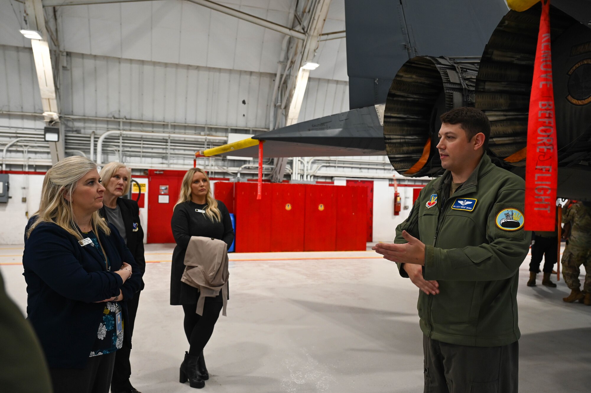 U.S. Air Force Maj. Seth Brown, 350th Spectrum Warfare Wing commander’s action group chief, briefs 350th SWW Honorary Commanders on the F-15E Strike Eagle during a tour at Eglin Air Force Base, Fla., Jan. 25, 2024. On the tour, Honorary Commanders were briefed on each of the units’ missions for the wing and shown statics of the F-15E and F-15EX Eagle II. (U.S. Air Force photo by Capt. Benjamin Aronson)