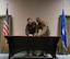 U.S. Air Force Col. Daniel Hoadley, 5th Bomb Wing commander, (left) and U.S. Air Force Col. Kenneth McGhee, 91st Missile Wing commander, pose before signing the Black History Month (BHM) proclamation at Minot Air Force Base, North Dakota, Feb. 1, 2024. It is a yearly tradition for the commanders at Minot AFB to sign a proclamation signifying the official start of Black History Month. (U.S. Air Force Photo by Airman 1st Class Luis Gomez)
