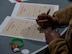 A member of Team Minot participates in a game of Black History Month (BHM) themed bingo at Minot Air Force Base, North Dakota, Feb. 1, 2024. After the opening remarks members of Team Minot participated in BHM bingo and trivia games. (U.S. Air Force Photo by Airman 1st Class Luis Gomez)