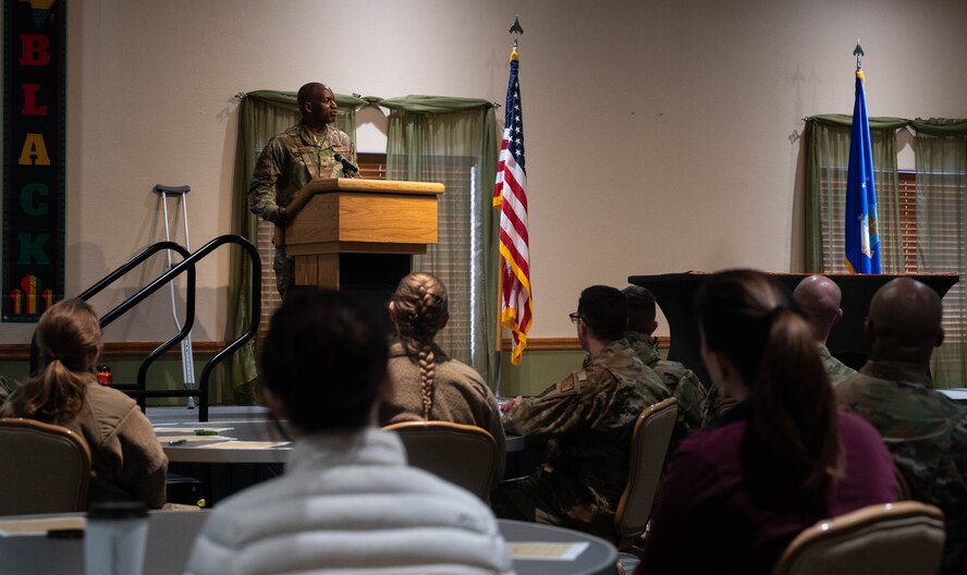 U.S. Air Force Col. Kenneth McGhee, 91st Missile Wing commander, gives opening remarks during the Black History Month (BHM) opening ceremony at Minot Air Force Base, North Dakota, Feb. 1, 2024. After the opening remarks members of Team Minot participated in BHM bingo and trivia games. (U.S. Air Force Photo by Airman 1st Class Luis Gomez)