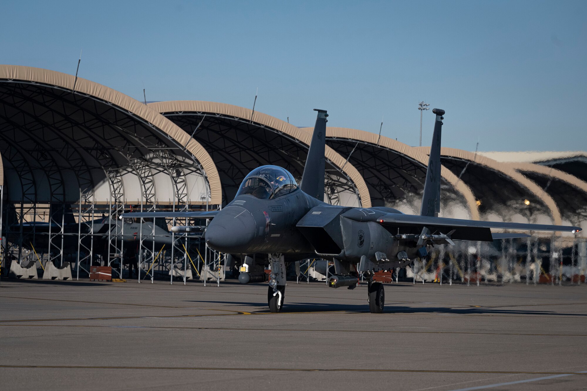 A U.S. Air Force crew chief assigned to the 4th Fighter Wing, performs an inspection on an F-15E Strike Eagle at Seymour Johnson Air Force Base, North Carolina, Jan. 22, 2024. Crew chiefs specialize in detailed inspections, diagnosing malfunctions and record-keeping. (U.S. Air Force photo by Senior Airman Sabrina Fuller-Judd)