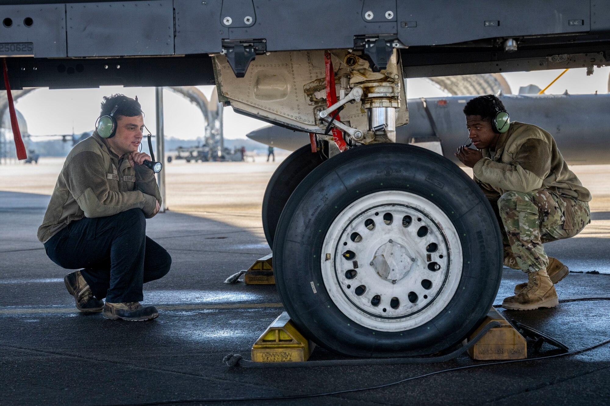 A U.S. Air Force crew chief assigned to the 4th Fighter Wing, performs an inspection on an F-15E Strike Eagle at Seymour Johnson Air Force Base, North Carolina, Jan. 22, 2024. Crew chiefs specialize in detailed inspections, diagnosing malfunctions and record-keeping. (U.S. Air Force photo by Senior Airman Sabrina Fuller-Judd)