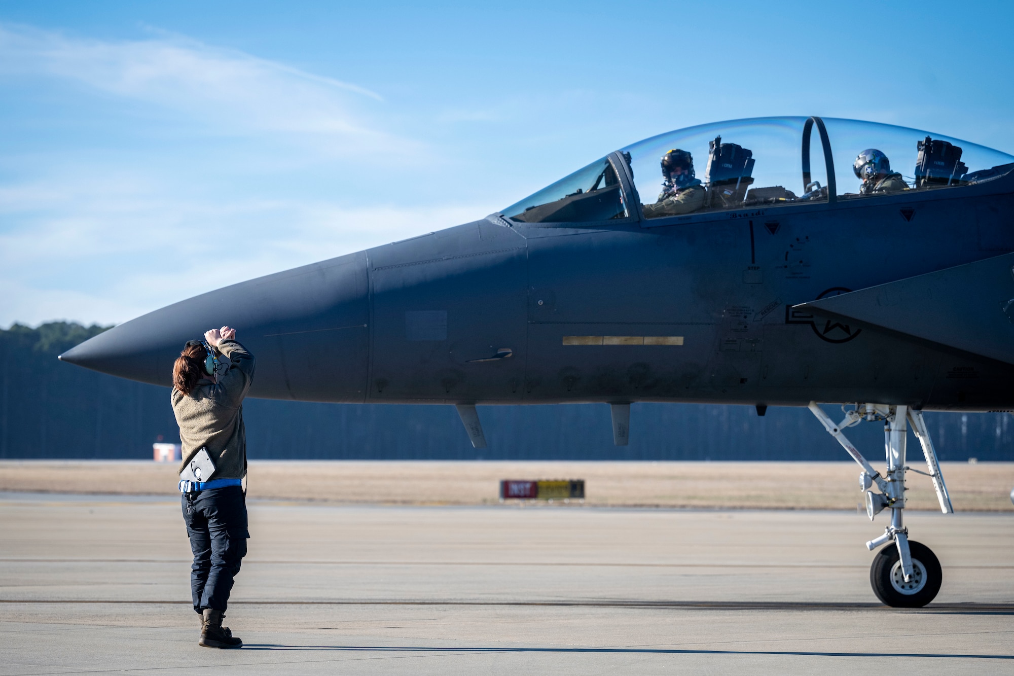 A U.S. Air Force crew chief assigned to the 4th Fighter Wing, performs an inspection on an F-15E Strike Eagle at Seymour Johnson Air Force Base, North Carolina, Jan. 22, 2024. Crew chiefs specialize in detailed inspections, diagnosing malfunctions and record-keeping. (U.S. Air Force photo by Senior Airman Sabrina Fuller-Judd)