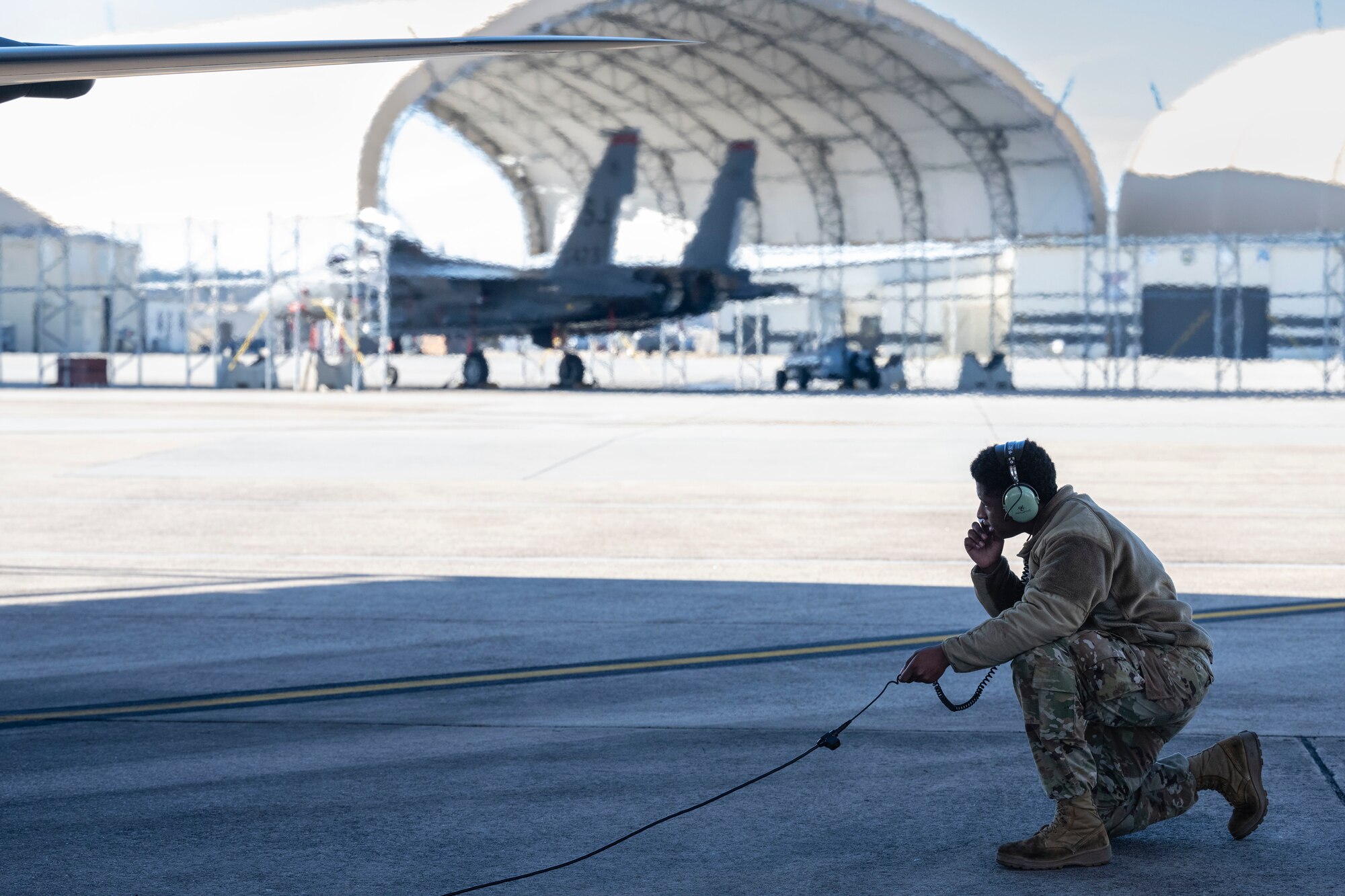 A U.S. Air Force crew chief assigned to the 4th Fighter Wing, performs an inspection on an F-15E Strike Eagle at Seymour Johnson Air Force Base, North Carolina, Jan. 22, 2024. Crew chiefs specialize in detailed inspections, diagnosing malfunctions and record-keeping. (U.S. Air Force photo by Senior Airman Sabrina Fuller-Judd)