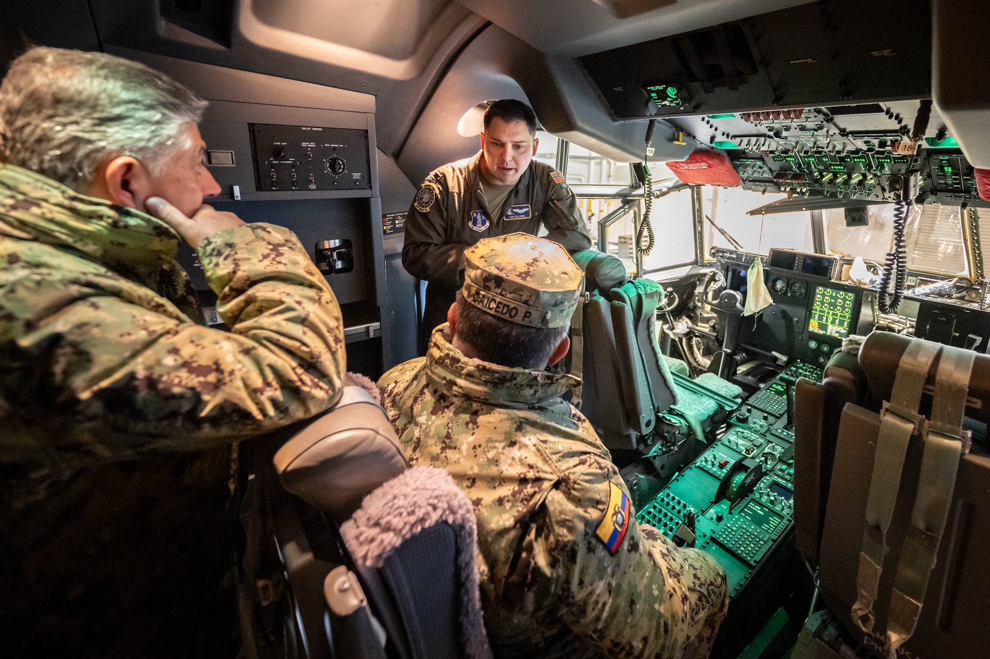 U.S. Air Force 1st Lt. Sam Williams, right, a C-130J Super Hercules pilot assigned to the Kentucky Air National Guard’s 123rd Airlift Wing, briefs senior leaders from the Ecuadorian military on the capabilities of the aircraft at the Kentucky Air National Guard Base in Louisville, Ky., Jan. 31, 2024. The Ecuadorians are visiting this week to exchange information with the Kentucky National Guard as part of the State Partnership Program, a National Guard Bureau effort that pairs Guard units with foreign allies to foster enhanced understanding across all aspects of civil and military affairs. (U.S. Air National Guard photo by Dale Greer)