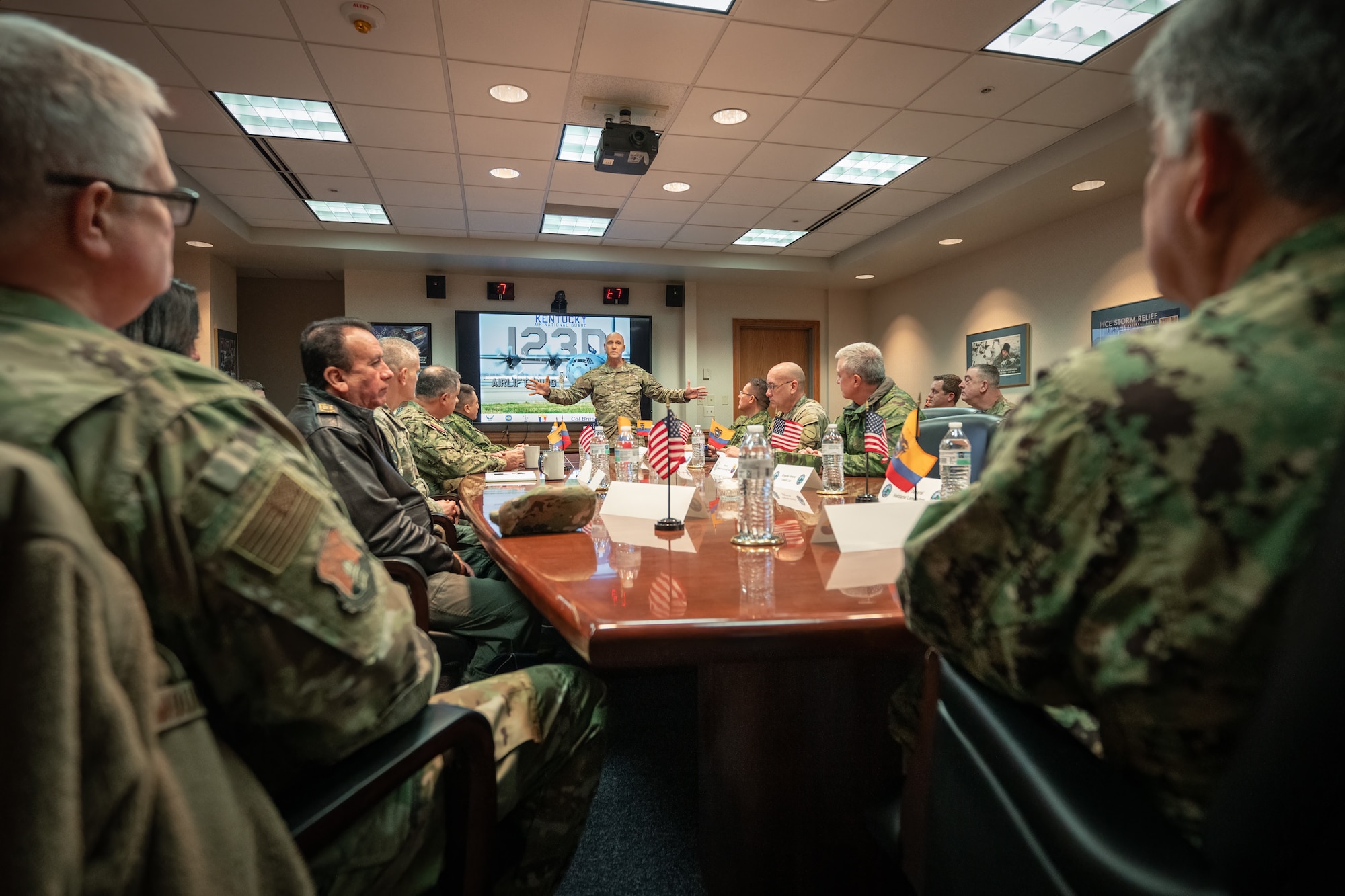 U.S. Air Force Col. George Imorde, deputy commander of the 123rd Airlift Wing, provides a mission brief to a group of Ecuadorian military leaders at the Kentucky Air National Guard Base in Louisville, Ky., Jan. 31, 2024. The Ecuadorians are visiting this week to exchange information with the Kentucky National Guard as part of the State Partnership Program, a National Guard Bureau effort that pairs Guard units with foreign allies to foster enhanced understanding across all aspects of civil and military affairs. (U.S. Air National Guard photo by Dale Greer) by Dale Greer)