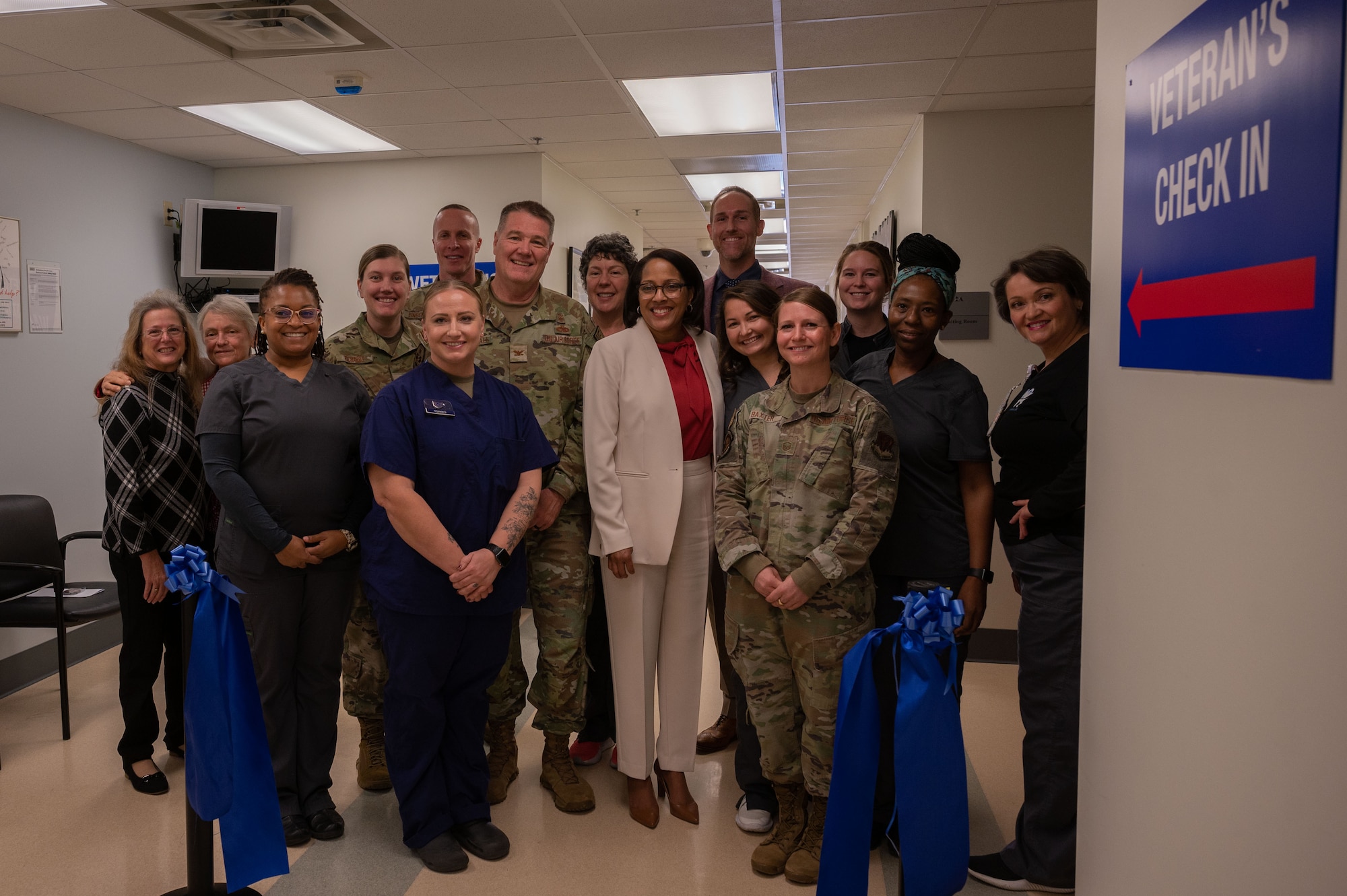 U.S. Aimen and Veterans Affairs dental clinic staff pose for a photo during a ribbon cutting ceremony for the VA Dental clinic at Seymour Johnson Air Force Base, North Carolina, Jan. 19, 2024. This clinic represents the inaugural collaboration at the 4th Fighter Wing dental clinic, where VA dental workers will partner with Kieker Dental Clinic Airmen to provide services for both active duty personnel and veterans with base access. (U.S. Air Force photo by Airman 1st Class Rebecca Sirimarco-Lang)