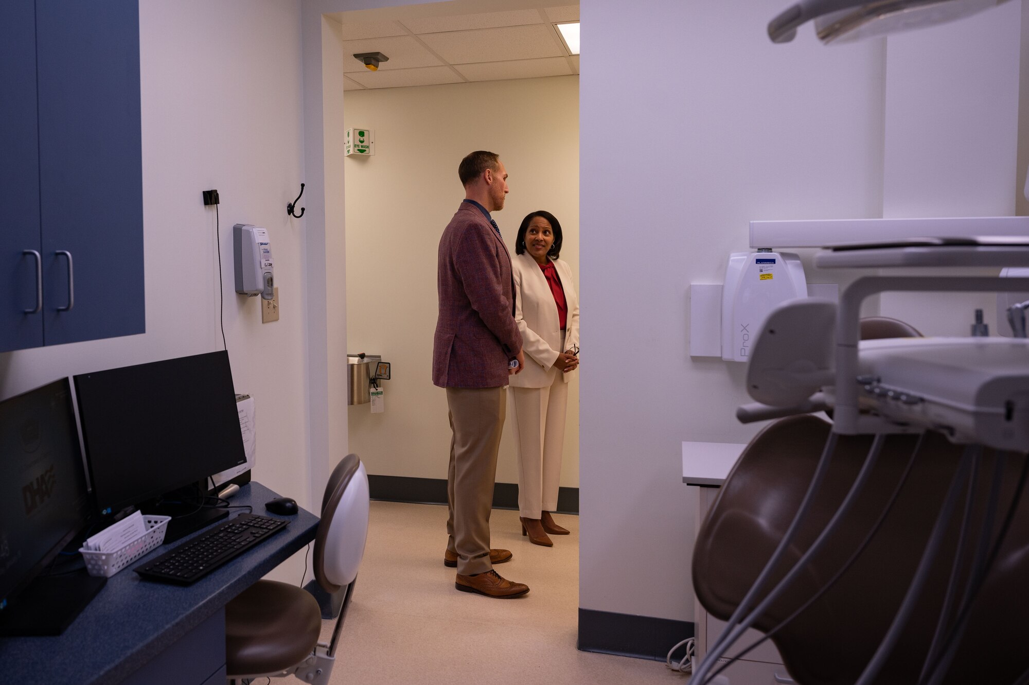 Dr. John McDaniel, Veterans Affairs Dental Chief, left, gave Marri Fryer, VA Coastal HealthCare System Executive Director, right, a tour of the dental clinic during a ribbon cutting ceremony for the VA Dental clinic at Seymour Johnson Air Force Base, North Carolina, Jan. 19, 2024. This clinic represents the inaugural collaboration at the 4th Fighter Wing dental clinic, where VA dental workers will partner with Kieker Dental Clinic Airmen to provide services for both active duty personnel and veterans with base access. (U.S. Air Force photo by Airman 1st Class Rebecca Sirimarco-Lang)