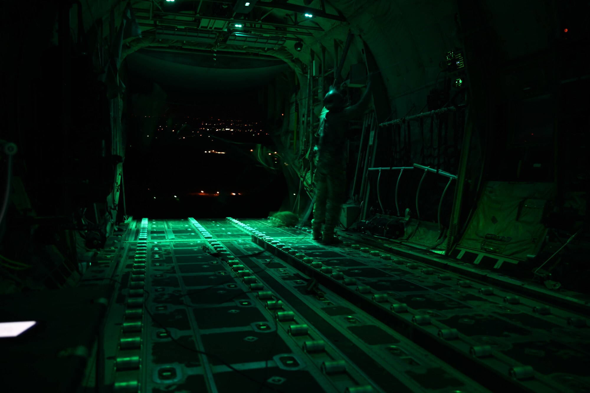 A C-130 drops cargo for an airdrop.