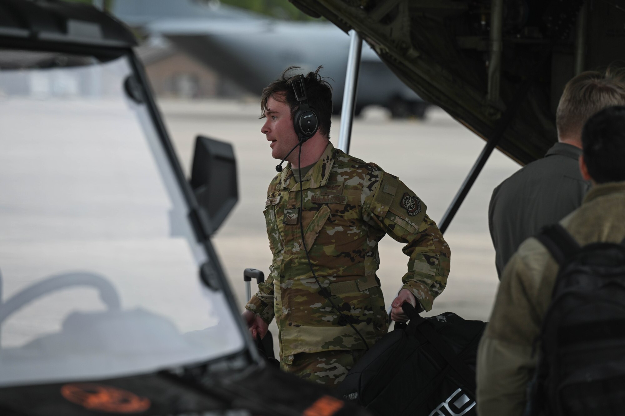 An Airman offloads cargo.