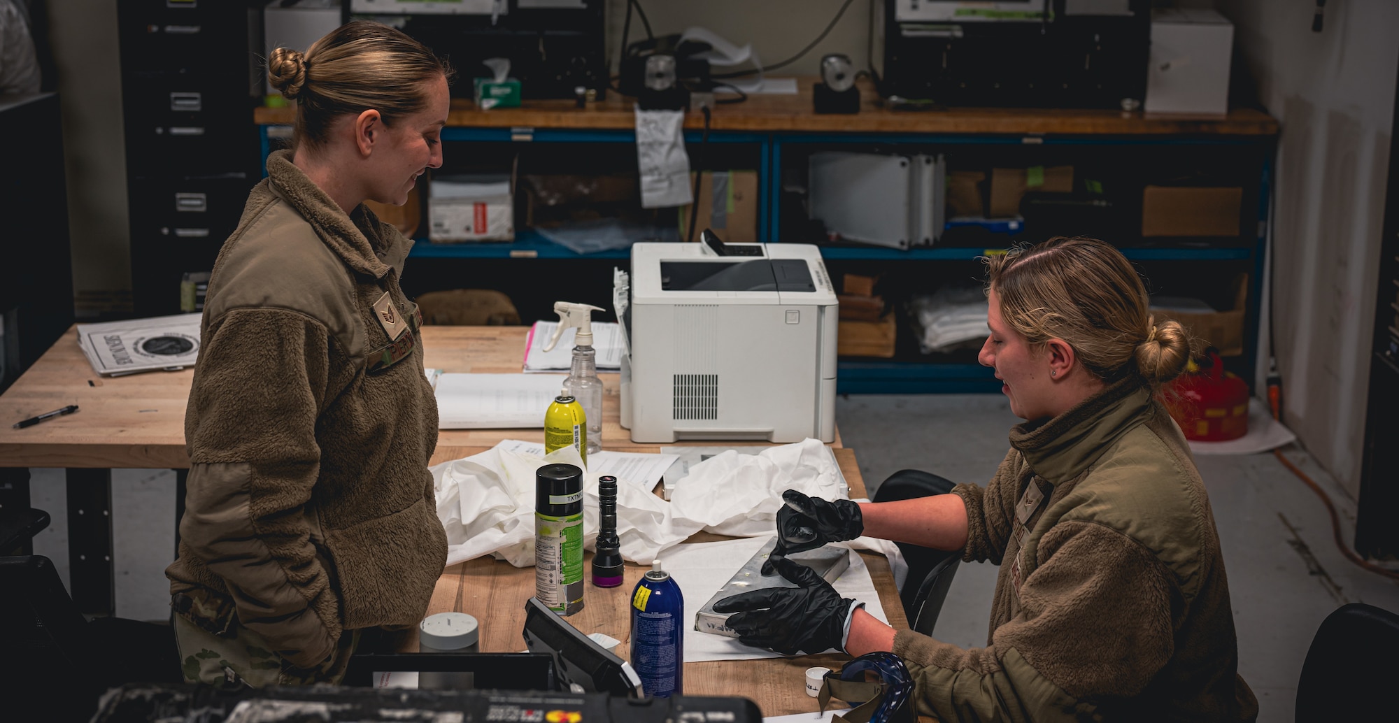Military member inspects equipment.