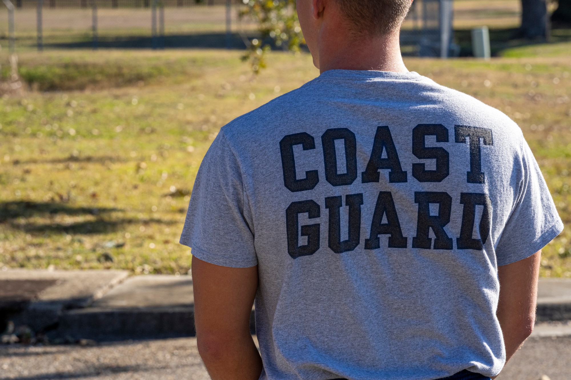 A Coast Guardsman participates in physical training with his Airman Leadership School teammates at Keesler Air Force Base, Mississippi, Jan. 18, 2024.