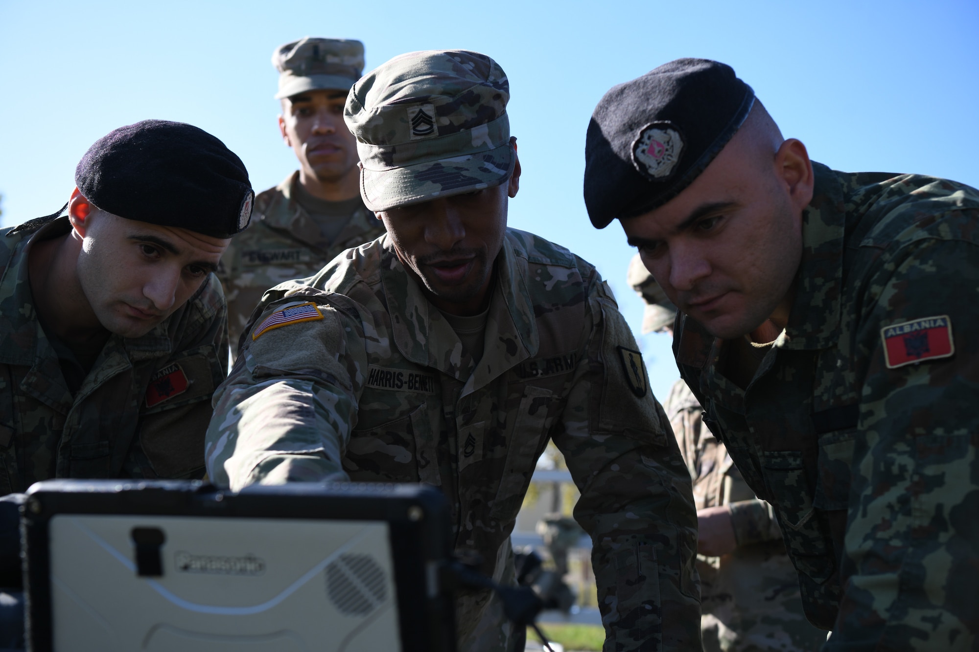 New Jersey Army National Guard soldiers, with the 254th Regimental Training Institute, and Albanian Armed Forces service members working on the setup of Puma AE3 DDL drone.