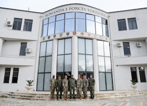 Service members with the U.S. Air and Army National Guard and Albanian Armed Forces pose for a group photo, at Land Forces Headquarters, Zall-Herr, Tirana, Albania.