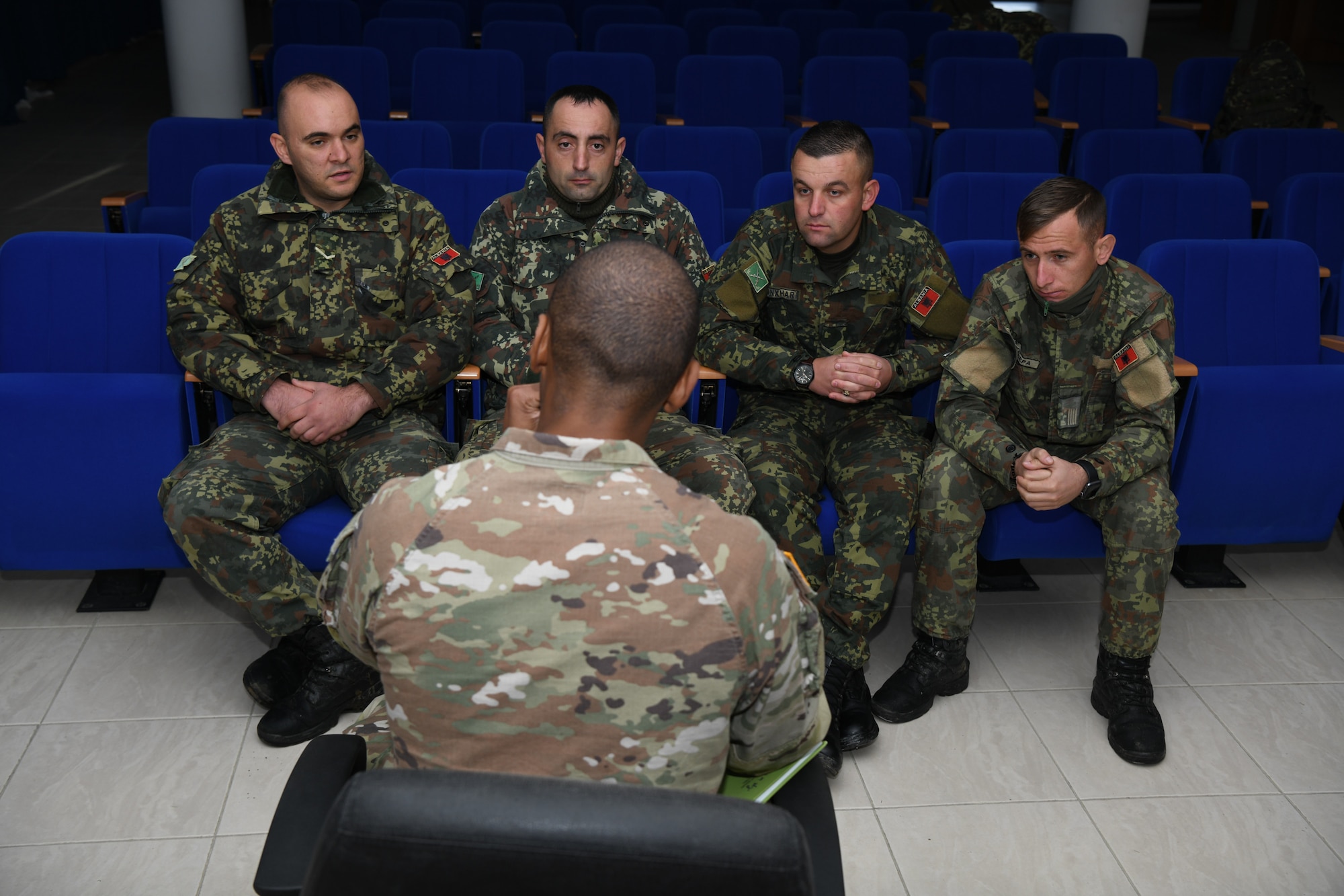 U.S. Army Sgt. 1st Class Justin Harris addresses Albanian Armed Forces leadership on the procedures of Puma AE3 DDL drone.