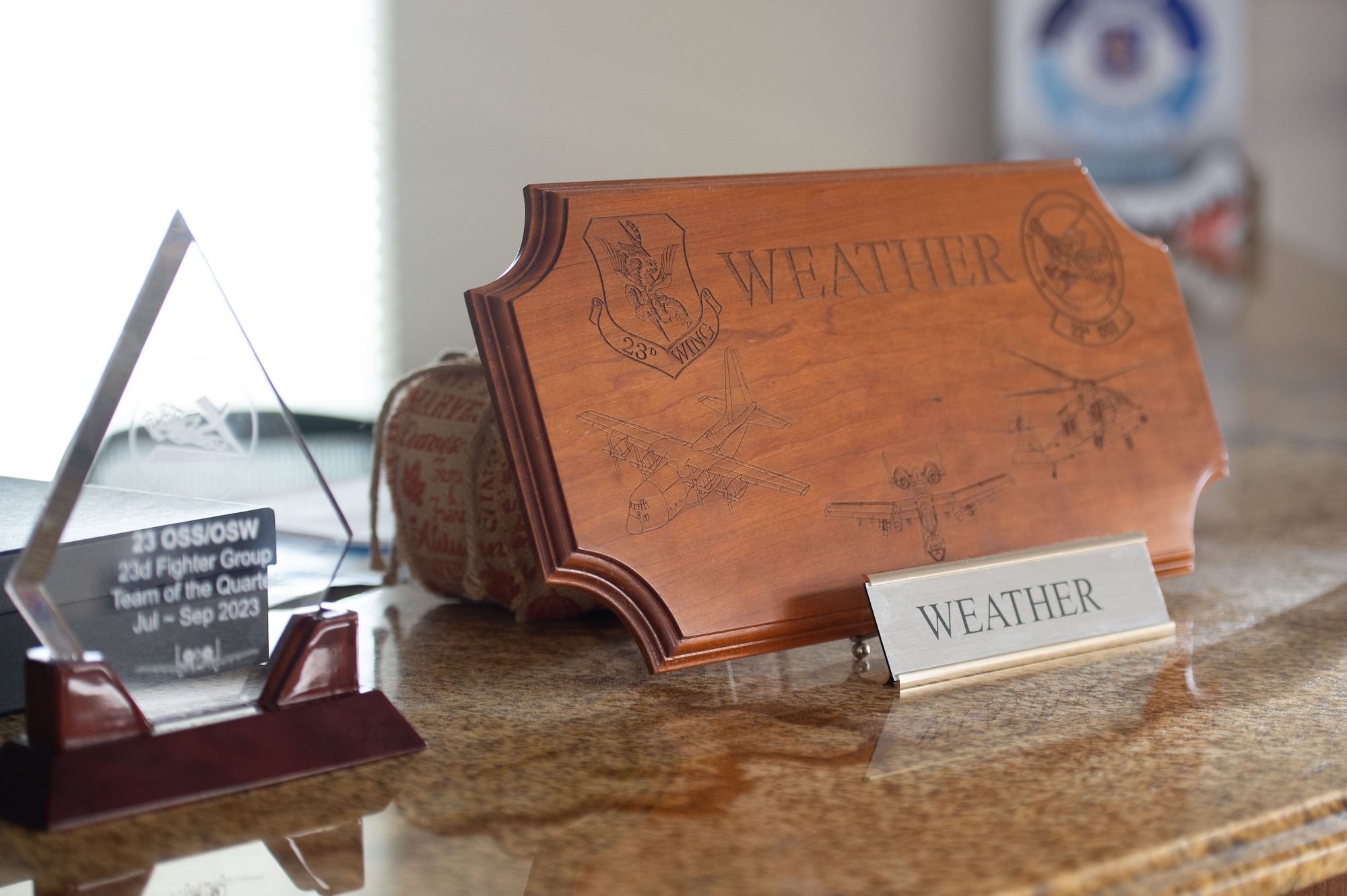 Photo of awards and plaques on a desk