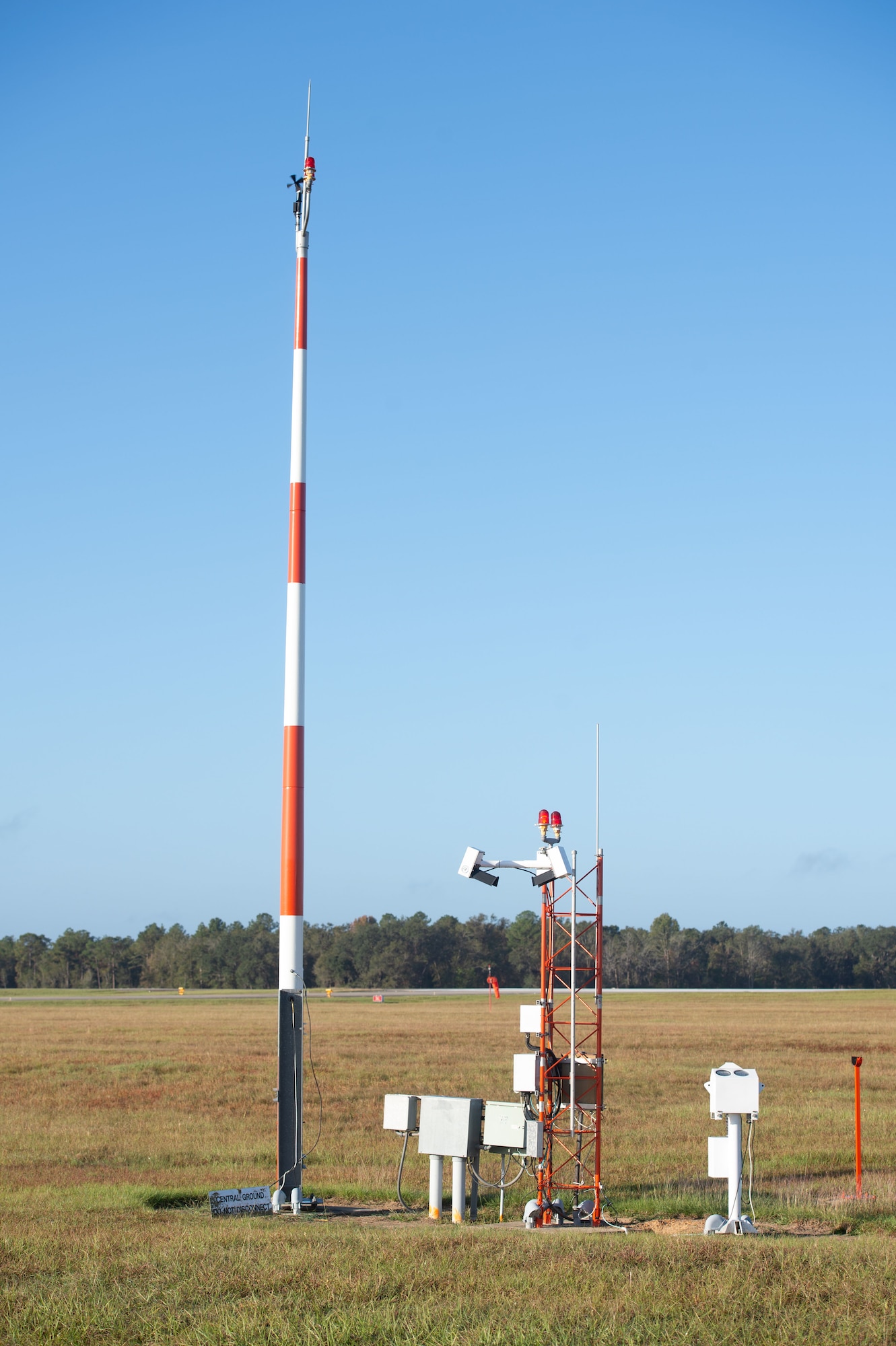 Photo of a weather tower in a field