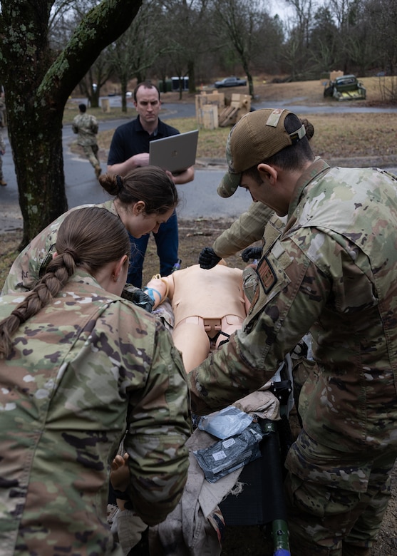 Members of the 316th Medical Group Ground Surgical Team provide aid to a medical training mannikin at Joint Base Andrews, Md., Jan. 25, 2024.