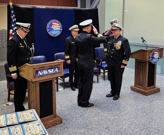 240202-N-N2201-001 (Feb. 2, 2024) WASHINGTON -- Capt. William “Bryant” Cleveland salutes PMS 312 Program Manager CAPT Mark Johnson during the Stand-Up Ceremony for the PMS 368 Aircraft Carrier Inactivation and Disposal Program Office. “The goal for Navy and this office is to be a responsible steward of the environment, while serving the needs of the Fleet and the trust of taxpayers,” Cleveland explained. “It’s full-time work—and a task that must be performed with the utmost respect for the legacy of these amazing warfighting platforms and the crews who served on them.”