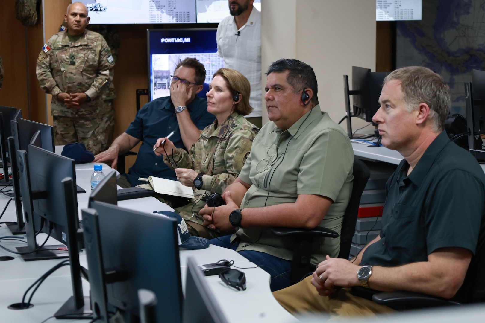 Military leaders listen to a briefing.