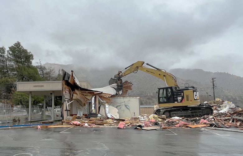 An excavator demolishes the former Bank of America building in Lake Isabella, California.