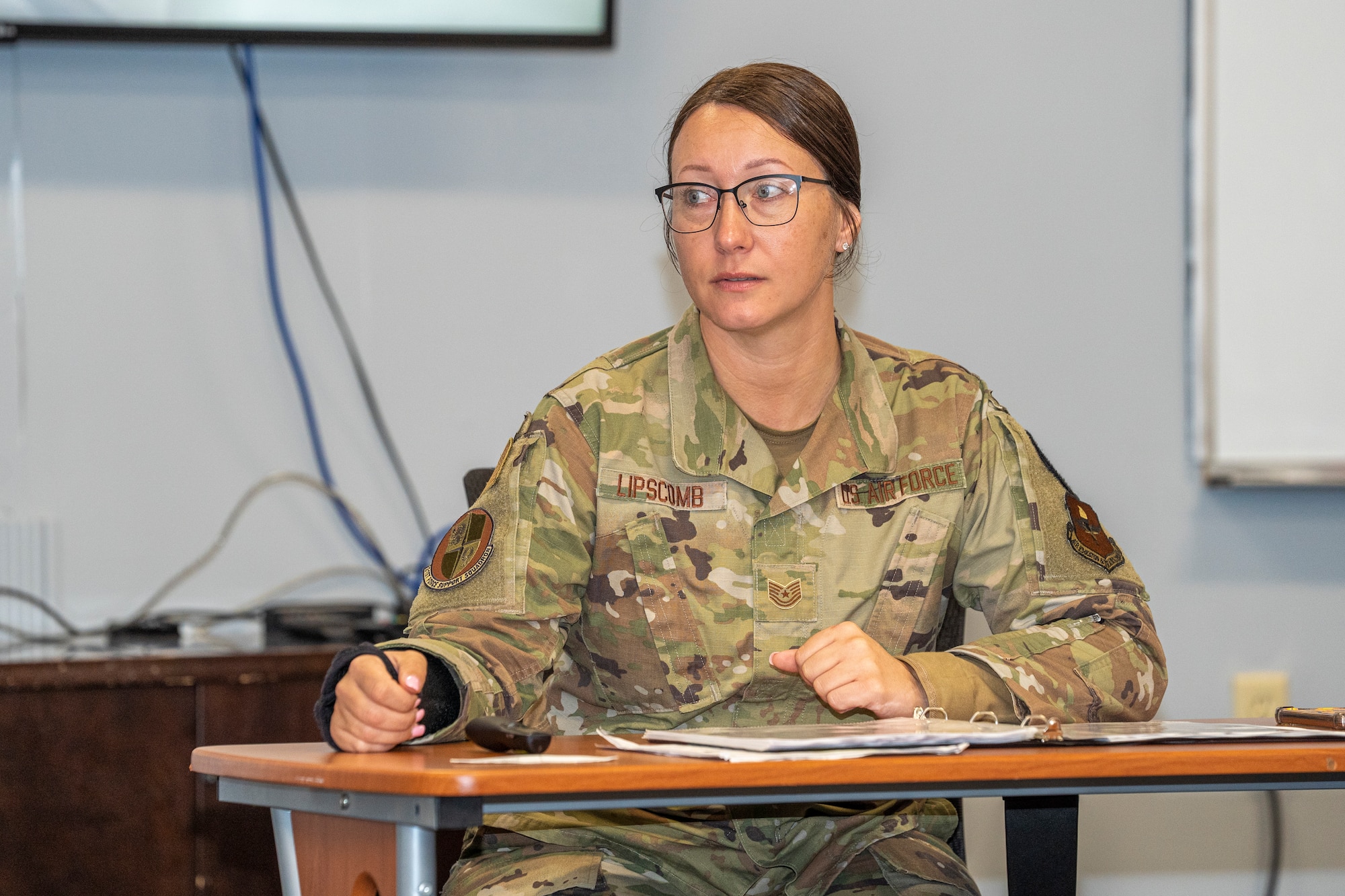 U.S. Air Force Tech. Sgt. Sarah Lipscomb, Airman Leadership School instructor, listens to students discuss the Air Force core mission at ALS on Keesler Air Force Base, Mississippi, Jan. 24, 2024.