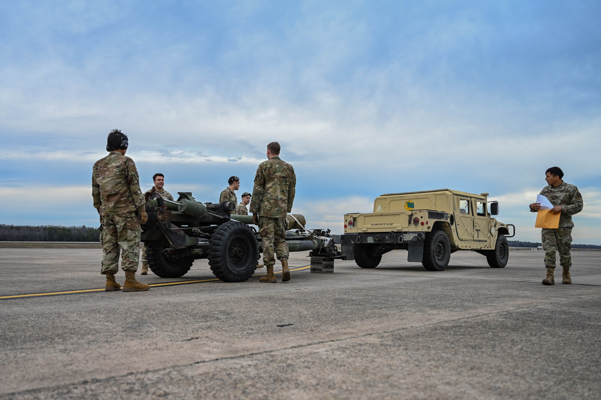 Airmen load cargo.