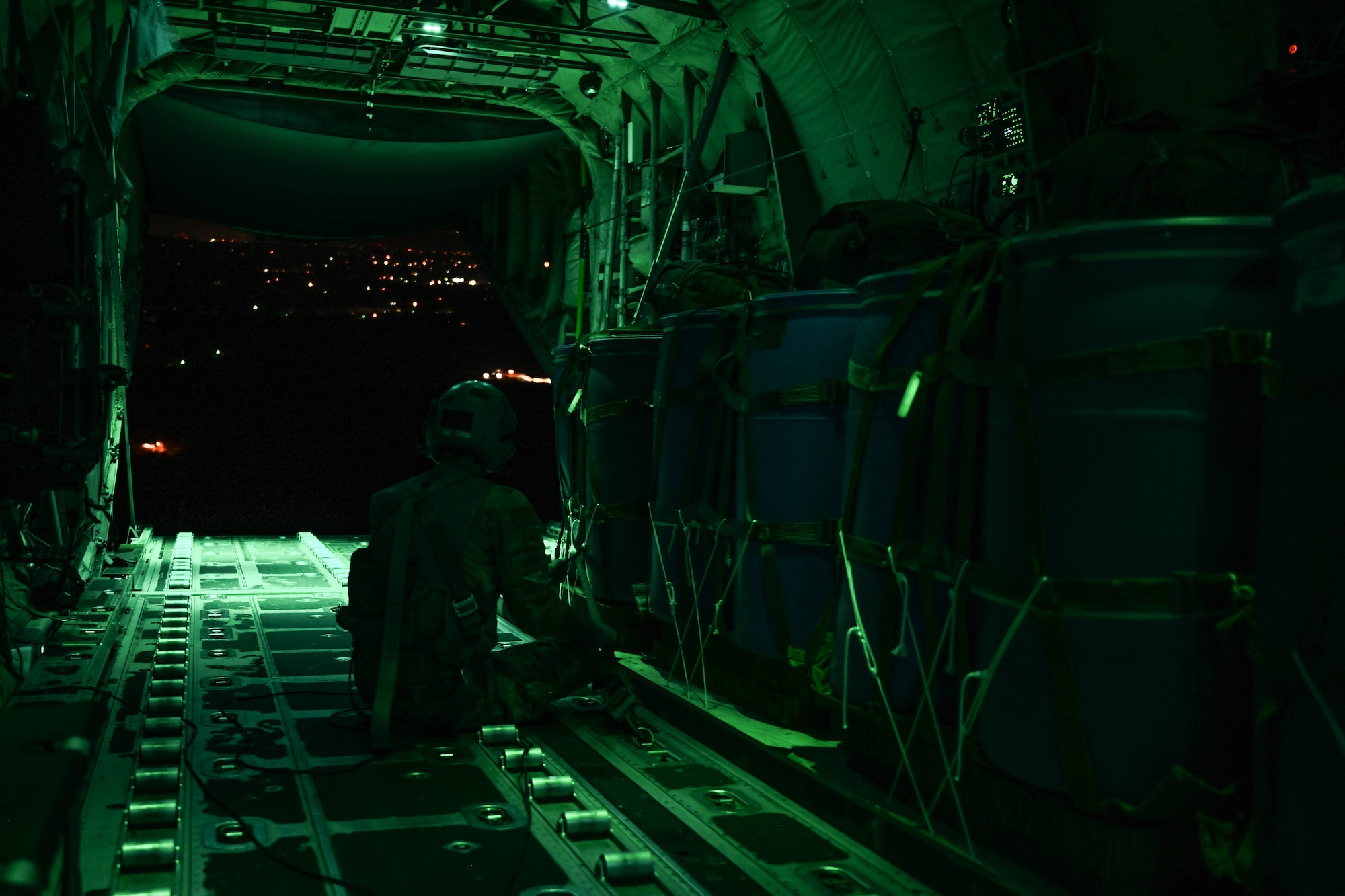 Am Airmen preps cargo for an airdrop.