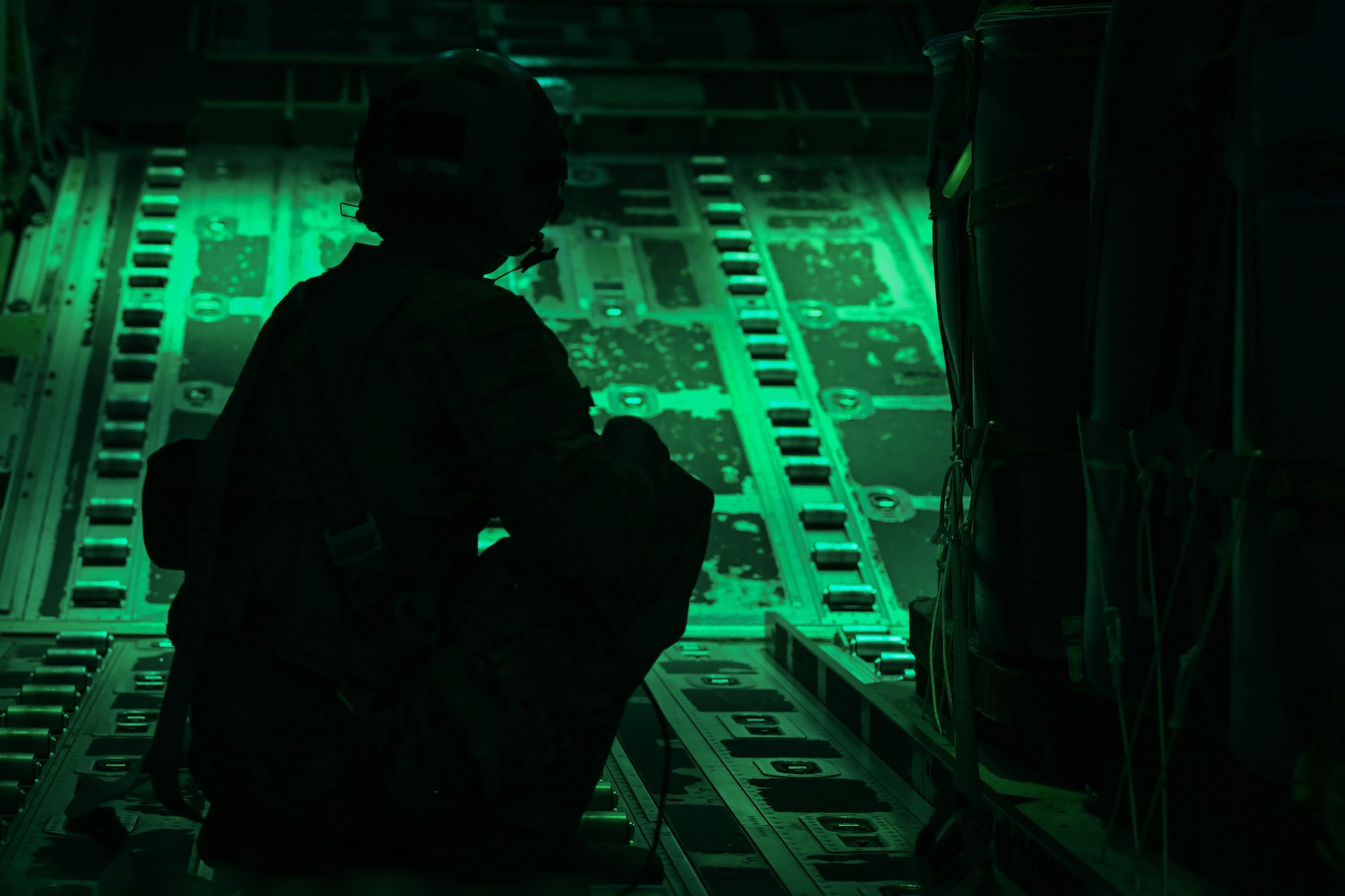 An Airman preps cargo for an airdrop.