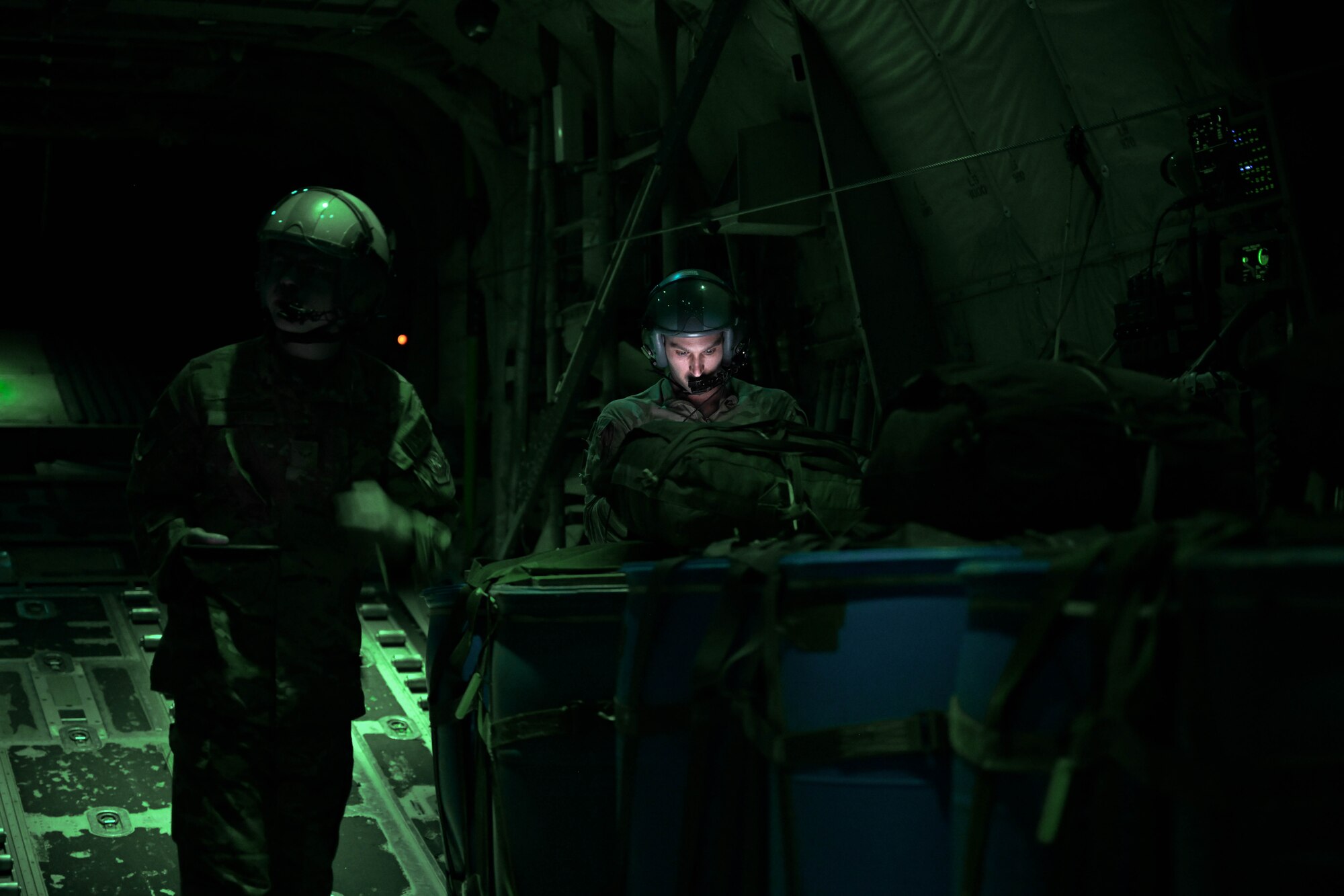 Airmen prep cargo for an airdrop.