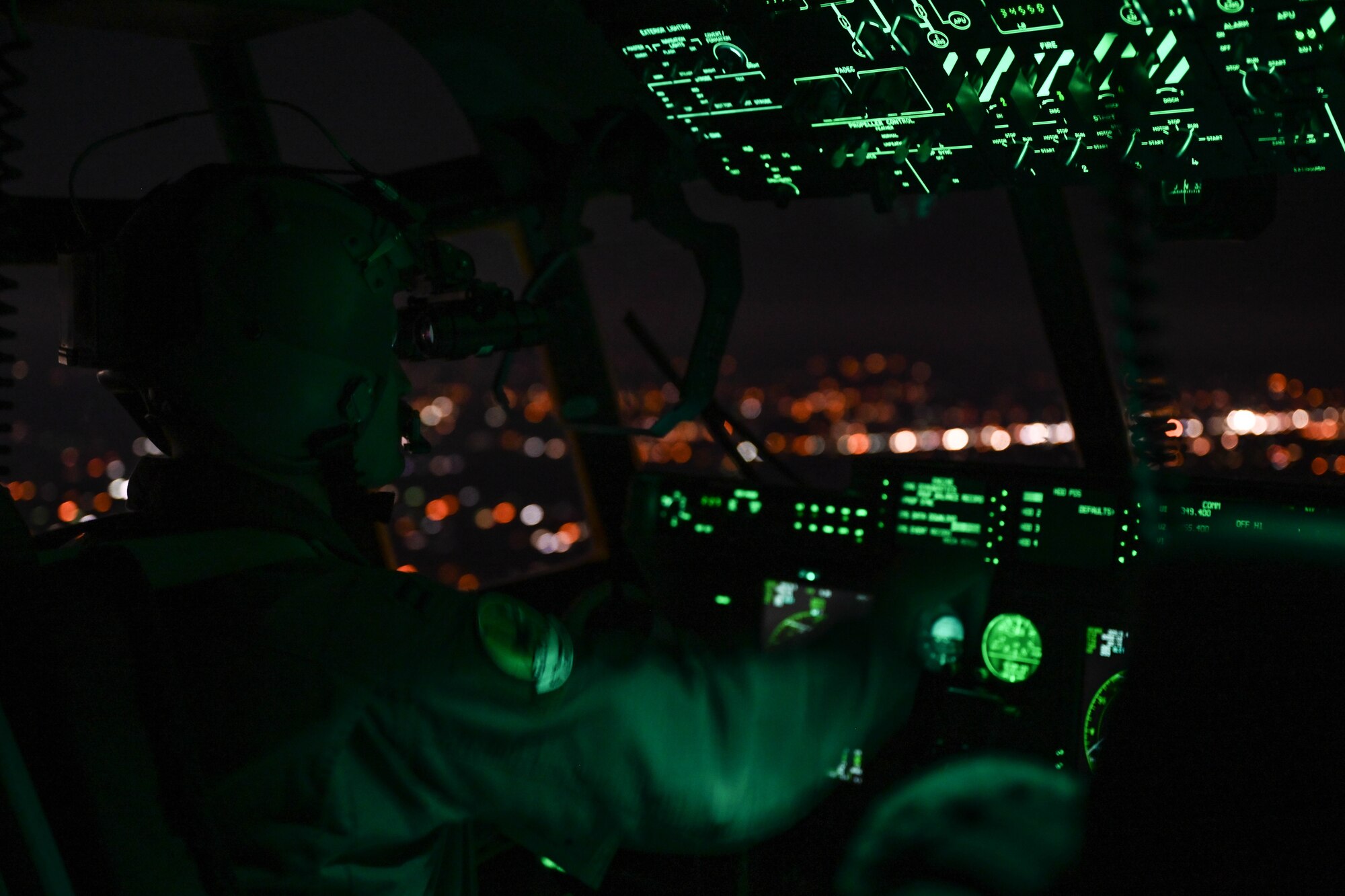 A pilot flies a C-130.