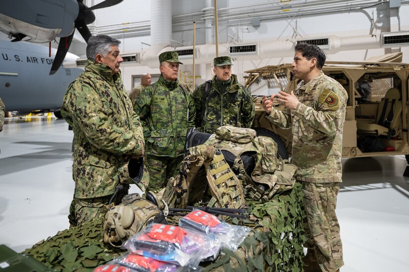 U.S. Air Force Master Sgt. Elmer Quijada, right, a pararescueman assigned to the Kentucky Air National Guard’s 123rd Special Tactics Squadron, provides a mission brief to key leaders from the Ecuadorian military at the Kentucky Air National Guard Base in Louisville, Ky., Jan. 31, 2024. The Ecuadorians are visiting this week to exchange information with the Kentucky National Guard as part of the State Partnership Program, a National Guard Bureau effort that pairs Guard units with foreign allies to foster enhanced understanding across all aspects of civil and military affairs. (U.S. Air National Guard photo by Dale Greer)