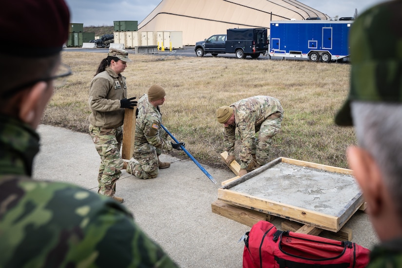 U.S. Army Soldiers assigned to the Kentucky National Guard’s Chemical, Biological, Radiological, Nuclear and high-yield Explosive (CBRNE) Enhanced Response Force Package, demonstrate techniques used to recover people trapped under debris as part of a mission brief for Ecuadorian military leaders at the Kentucky Air National Guard Base in Louisville, Ky., Jan. 31, 2024. The Ecuadorians are visiting this week to exchange information with the Kentucky National Guard as part of the State Partnership Program, a National Guard Bureau effort that pairs Guard units with foreign allies to foster enhanced understanding across all aspects of civil and military affairs. (U.S. Air National Guard photo by Dale Greer)