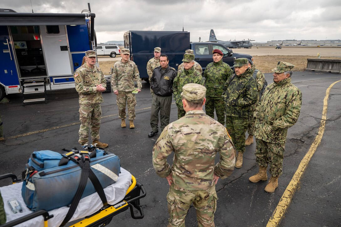 U.S. Army Capt. Patrick McCoy, left, officer in charge of the Kentucky National Guard’s 41st Civil Support Team – Weapons of Mass Destruction, provides a mission brief to key leaders from the Ecuadorian military at the Kentucky Air National Guard Base in Louisville, Ky., Jan. 31, 2024. The Ecuadorians are visiting this week to exchange information with the Kentucky National Guard as part of the State Partnership Program, a National Guard Bureau effort that pairs Guard units with foreign allies to foster enhanced understanding across all aspects of civil and military affairs. (U.S. Air National Guard photo by Dale Greer)