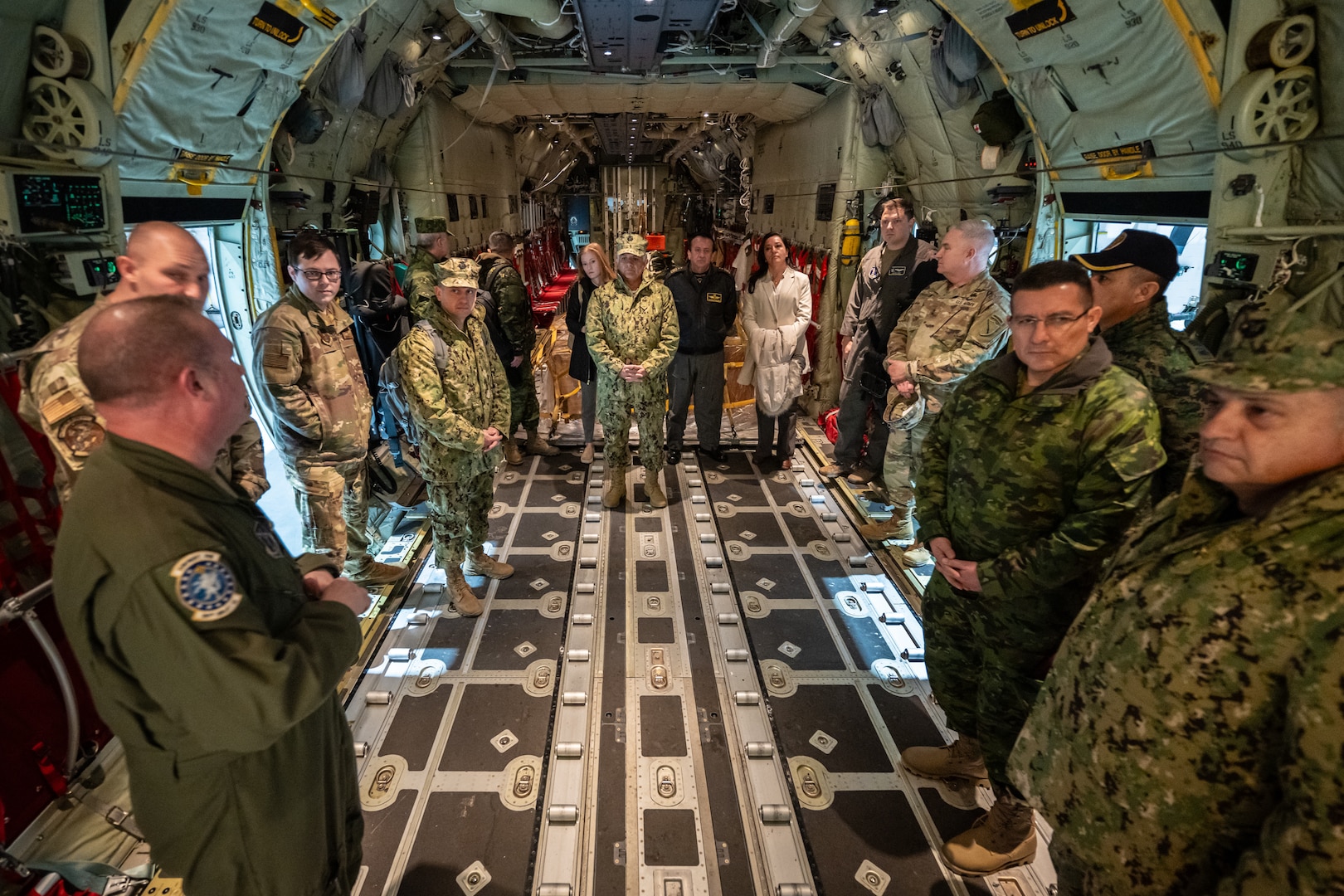 U.S. Air Force Senior Master Sgt. Collin King, left, a loadmaster assigned to the Kentucky Air National Guard’s 123rd Airlift Wing, briefs senior leaders from the Ecuadorian military on the capabilities of the unit’s new C-130J Super Hercules aircraft at the Kentucky Air National Guard Base in Louisville, Ky., Jan. 31, 2024. The Ecuadorians are visiting this week to exchange information with the Kentucky National Guard as part of the State Partnership Program, a National Guard Bureau effort that pairs Guard units with foreign allies to foster enhanced understanding across all aspects of civil and military affairs. (U.S. Air National Guard photo by Dale Greer)