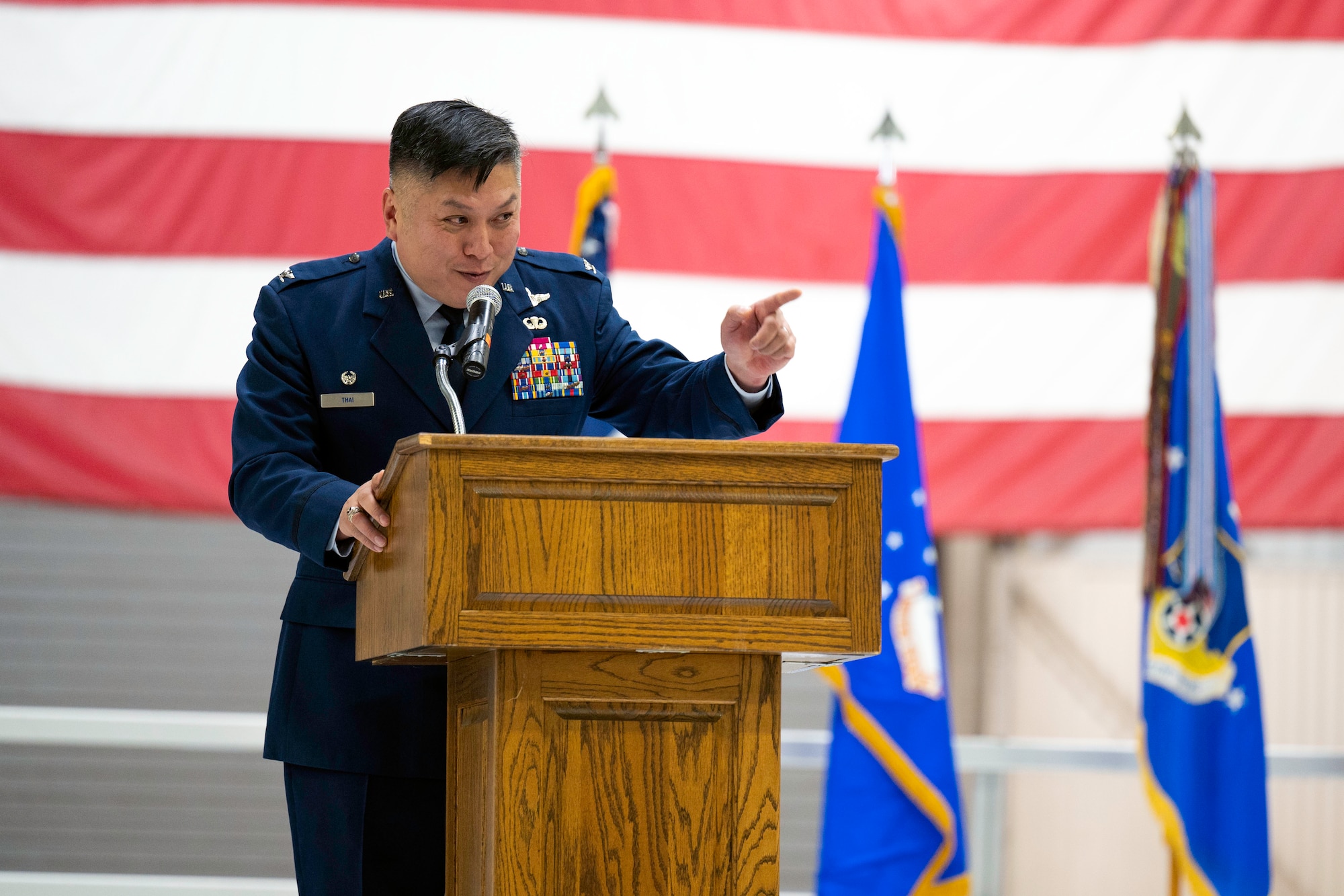Col. Van Thai, incoming 434th Air Refueling Wing commander, delivers remarks to members of the 434th Air Refueling Wing during a change of command ceremony.