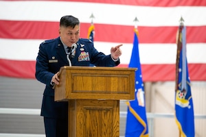 Maj. Gen. D. Scott Durham, Fourth Air Force commander passes the 434th Air Refueling Wing guidon to Col. Van Thai, incoming 434th Air Refueling Wing commander, during a ceremony.
