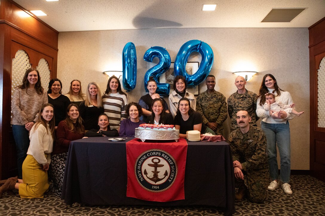 Volunteers with the Navy and Marine Corps Relief Society pose for a group photo at Marine Corps Air Station Iwakuni, Japan, Jan. 23, 2024. The MCAS Iwakuni NMCRS hosted a luncheon to recognize volunteers for their service to the community and celebrates the 120th birthday of the organization (U.S. Marine Corps photo by Lance Cpl. Rylan Adcock).