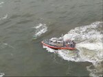 A Coast Guard Station Mayport boat crew rescues three people after their 26-foot sailboat sank near St. Marys Inlet, Georgia, Feb. 4, 2024.