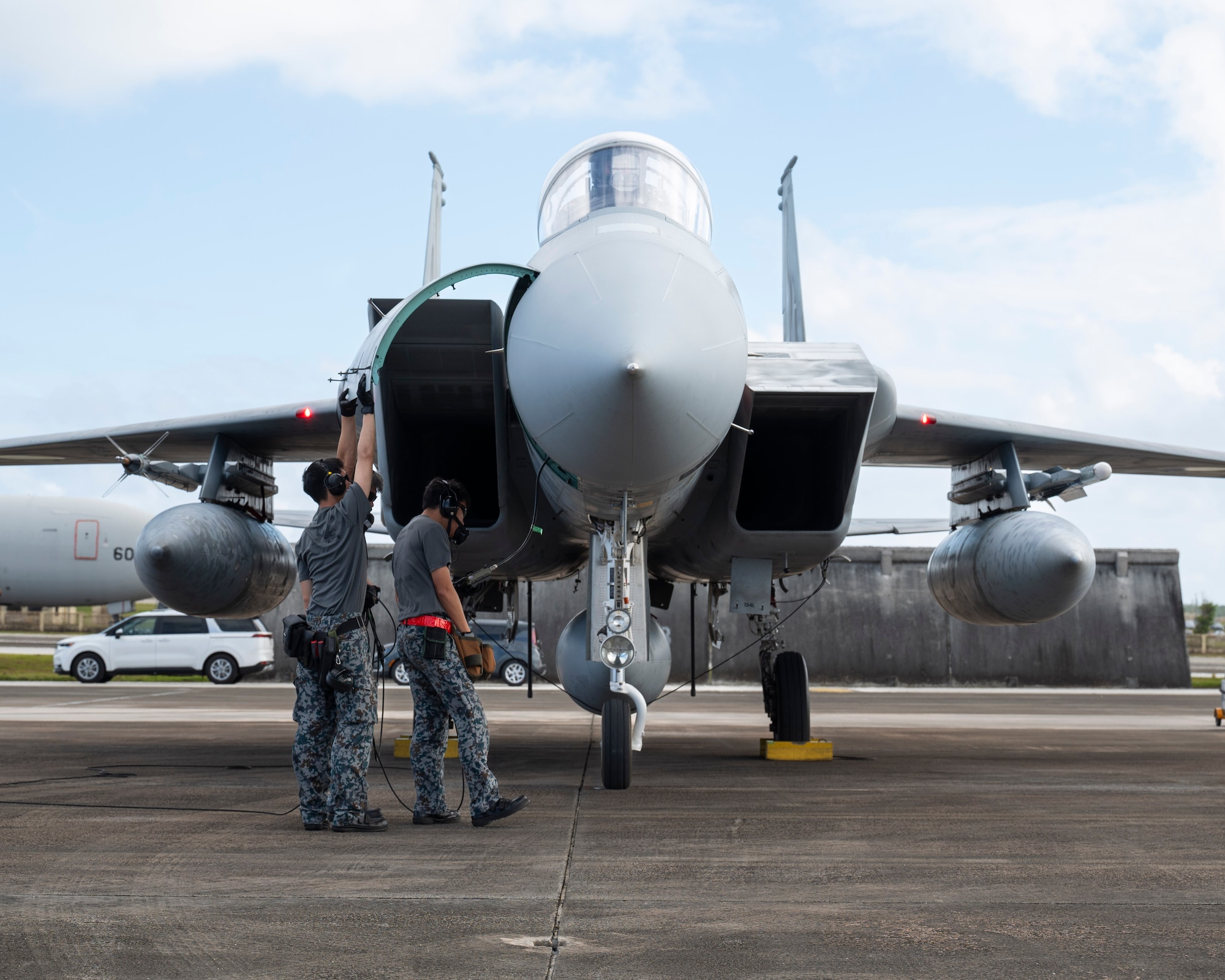 Members of the Japan Air Self-Defense Force perform checks on a F-15J Eagle during Cope North 24 on Andersen Air Force Base, Guam, Jan. 29, 2024. Cope North enhances U.S. relationships and interoperability with our regional Allies and partners by providing the opportunity to exchange information and improve shared tactics to better integrate multilateral defense capabilities. (U.S. Air Force photo by Airman 1st Class Spencer Perkins)