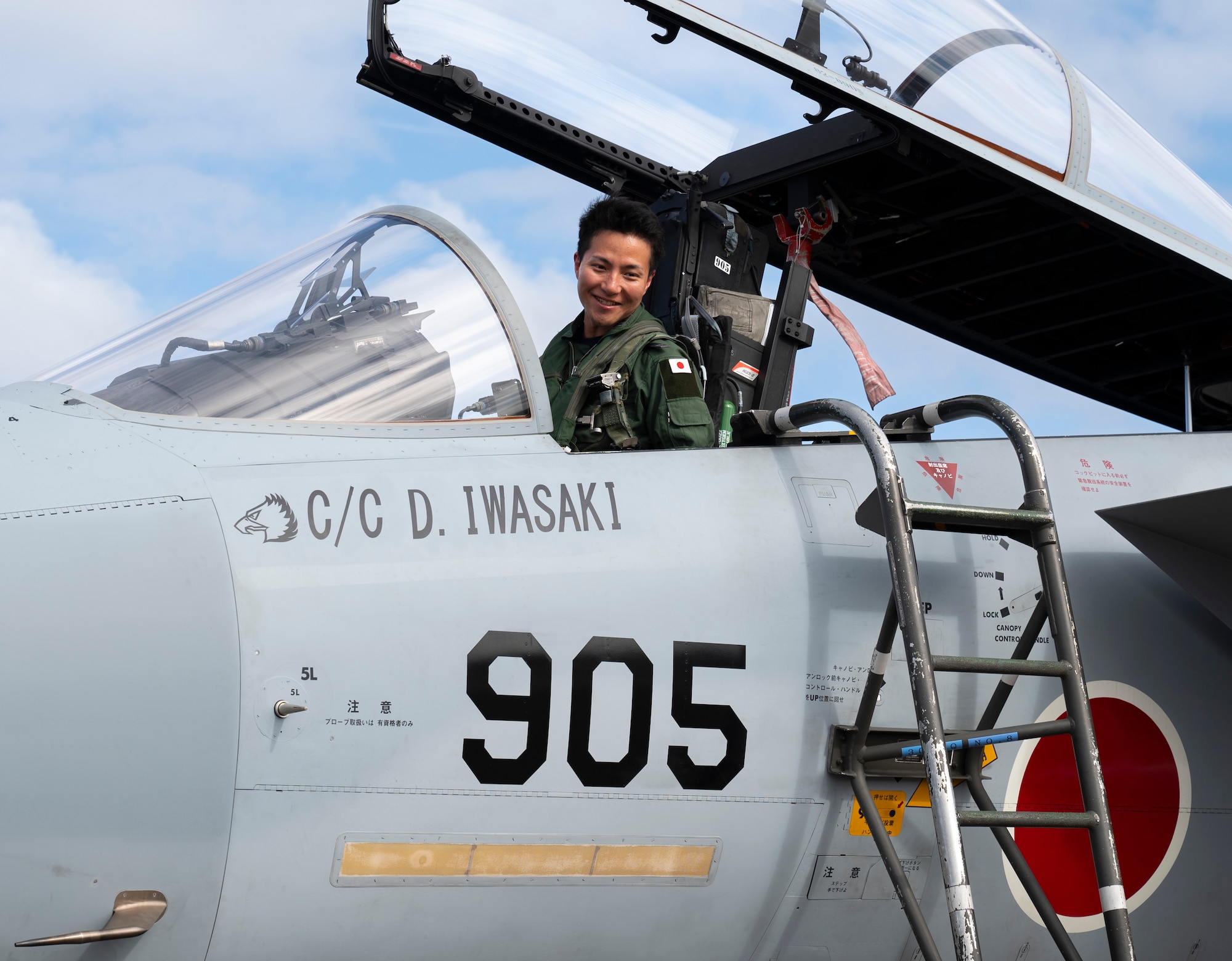 A member of the Japan Air Self-Defense Force prepares to exit an F-15J Eagle during Cope North 24 on Andersen Air Force Base, Guam, Jan. 29, 2024. Cope North enhances U.S. relationships and interoperability with our regional Allies and partners by providing the opportunity to exchange information and improve shared tactics to better integrate multilateral defense capabilities. (U.S. Air Force photo by Airman 1st Class Spencer Perkins)