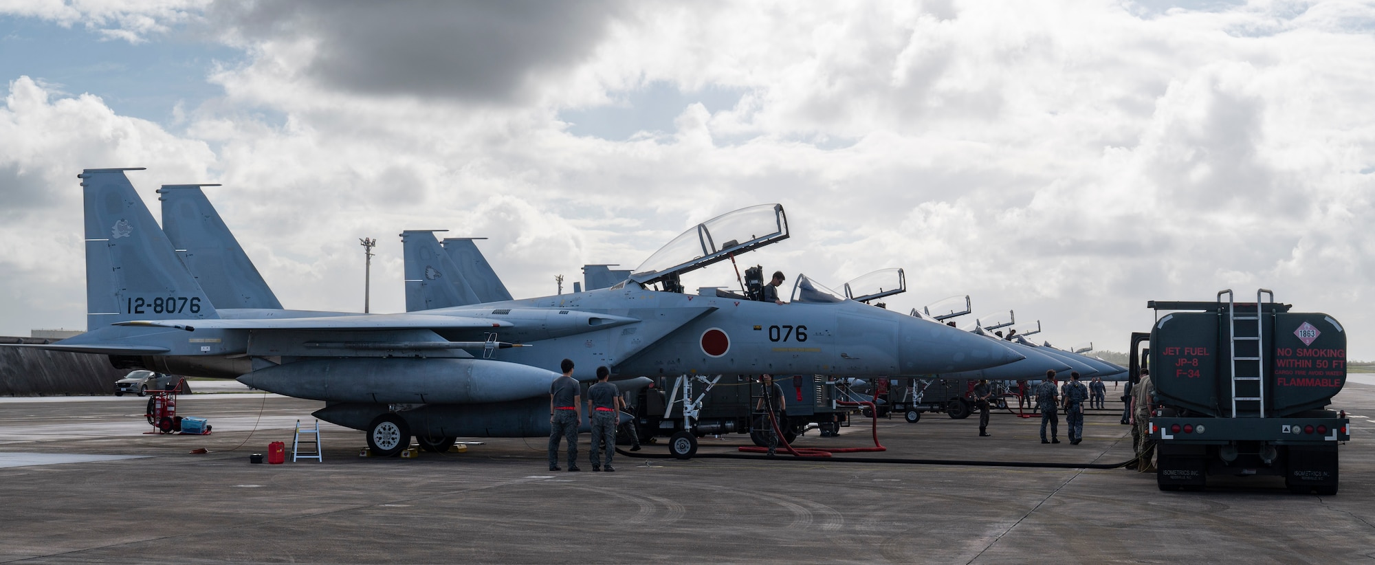 Members of the Japan Air Self-Defense Force and U.S. Air Force work on F15J Eagles during Cope North 24 on Andersen Air Force Base, Guam, Jan. 29, 2024. Cope North enhances U.S. relationships and interoperability with our regional Allies and partners by providing the opportunity to exchange information and improve shared tactics to better integrate multilateral defense capabilities. (U.S. Air Force photo by Airman 1st Class Spencer Perkins)