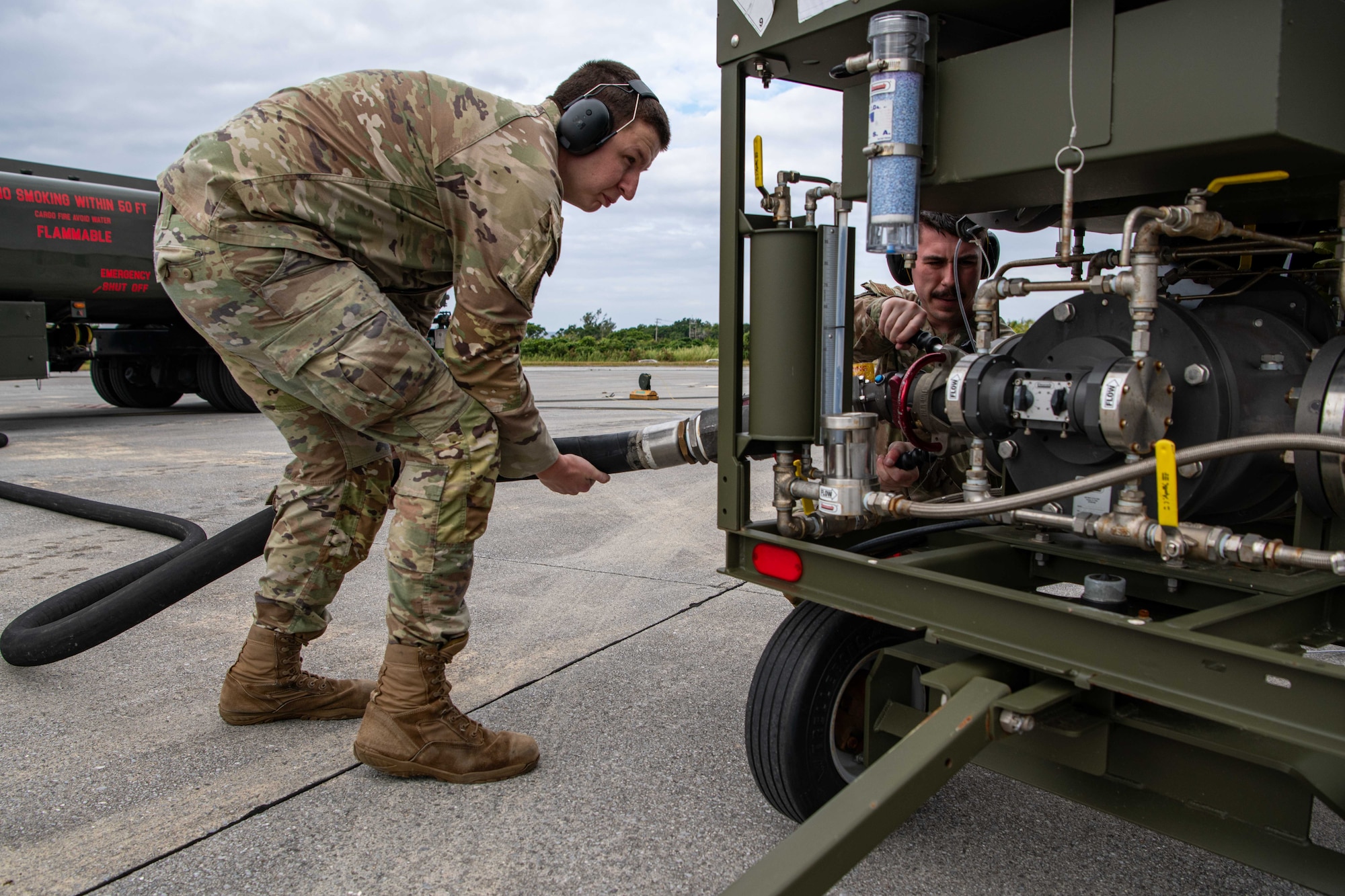 Two Airmen conduct refueling operations.