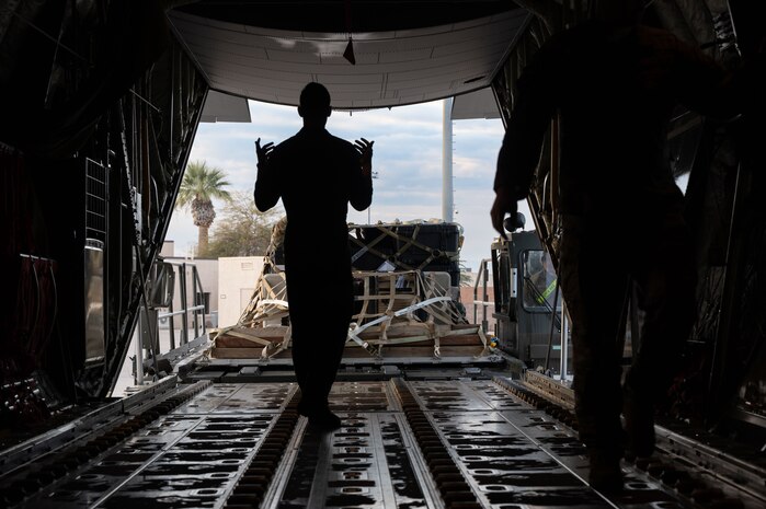 U.S. Air Force Airmen assigned to the 40th Air Lift Squadron and 515th Air Mobility Element (AME) load equipment onto a C-130J Super Hercules in support of Bamboo Eagle 24-1 at Nellis Air Force Base, Nevada, Jan. 25, 2023.