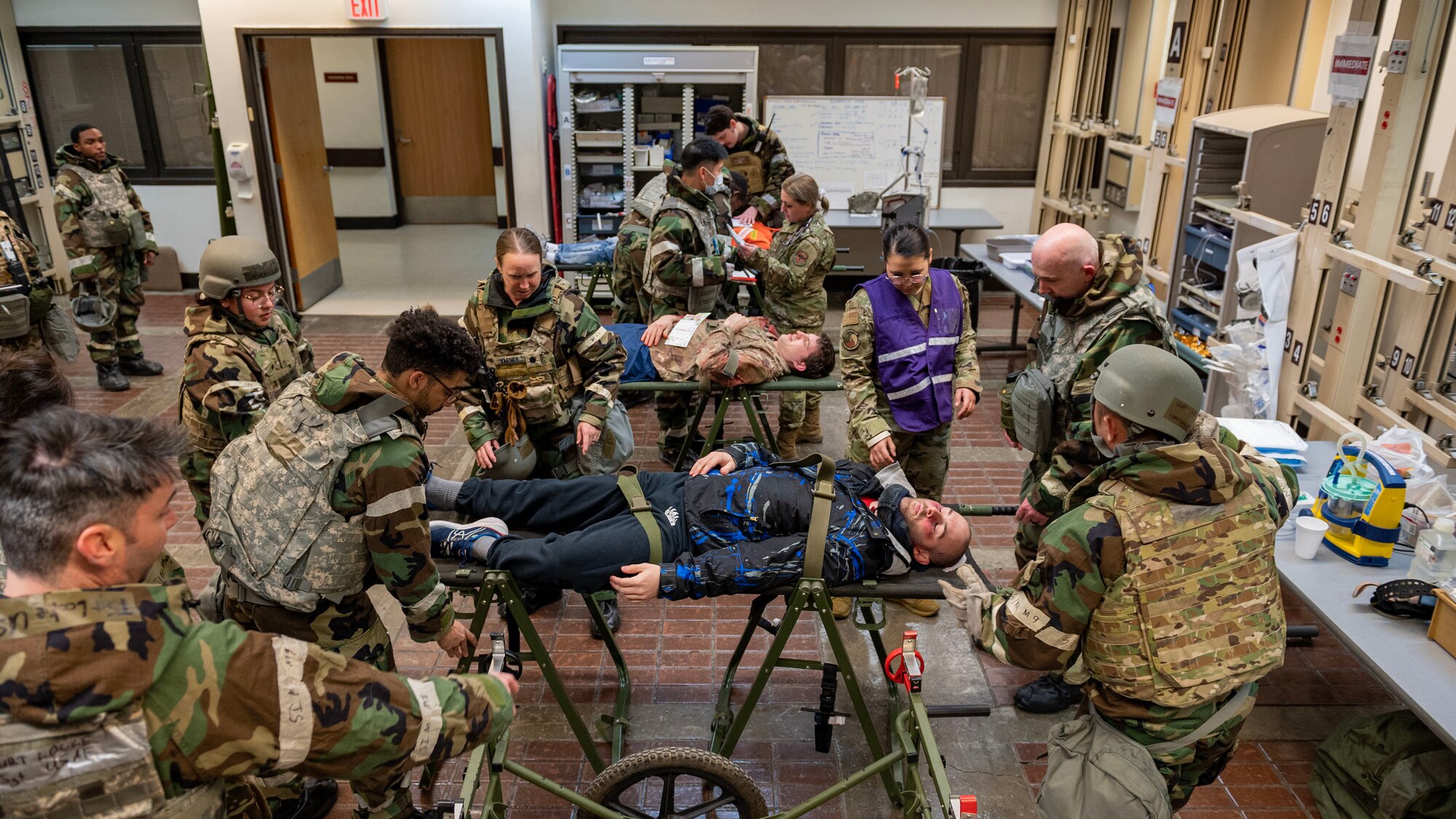 U.S. Air Force Airmen assigned to the 51st Medical Group treat simulated triage patients in a mass casualty training event during Beverly Midnight 24-1 at Osan Air Base, Republic of Korea, Feb. 1, 2024. During the training event, 80 simulated patients were brought to the 51st MDG to be treated. BM24-1 is a routine training event that tests the military capabilities across the peninsula, allowing combined and joint training at both the operational and tactical levels. (U.S. Air Force photo by Staff Sgt. Aubree Owens)